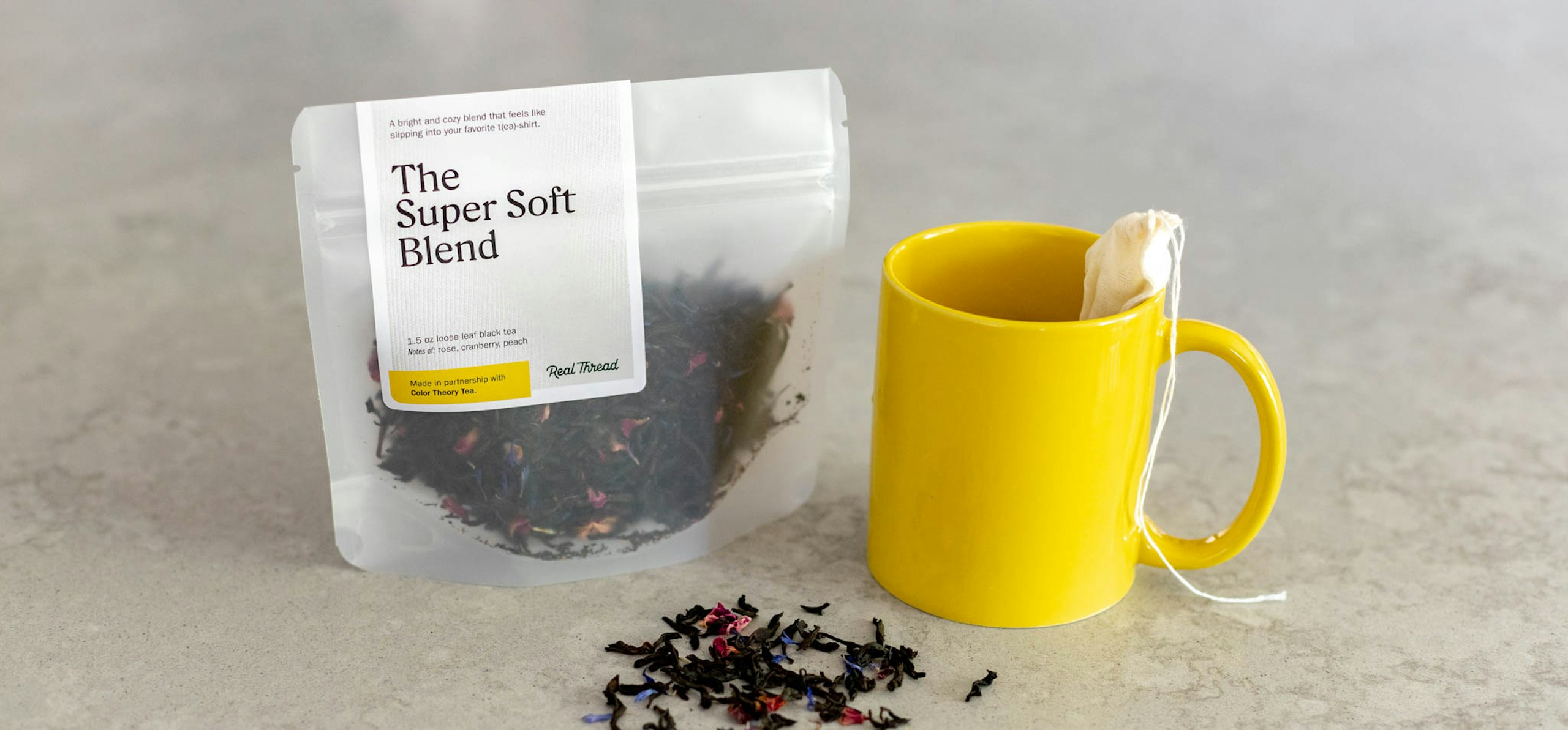 yellow tea mug with loose leaf tea
