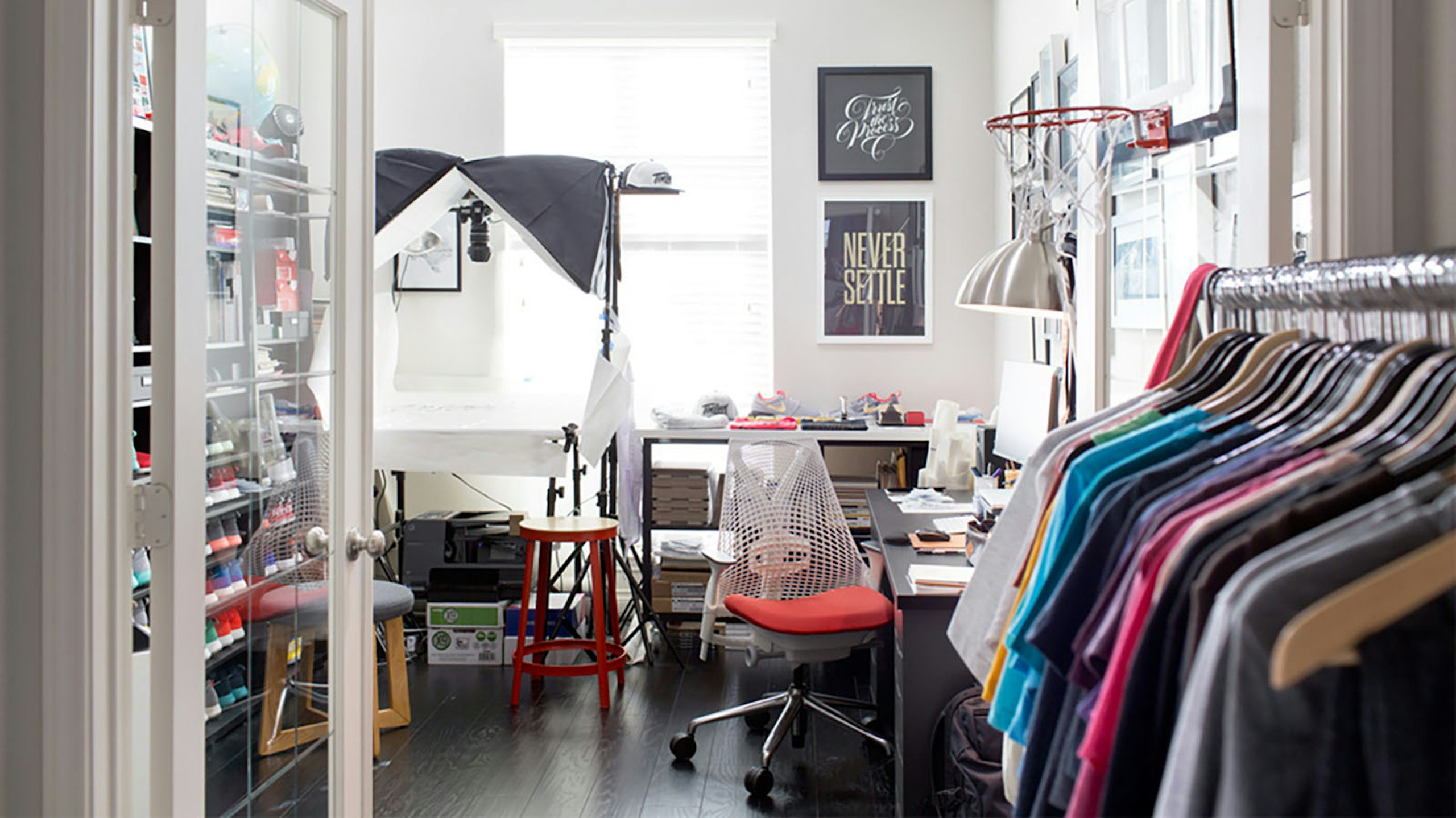 craft room with shirts and photo station
