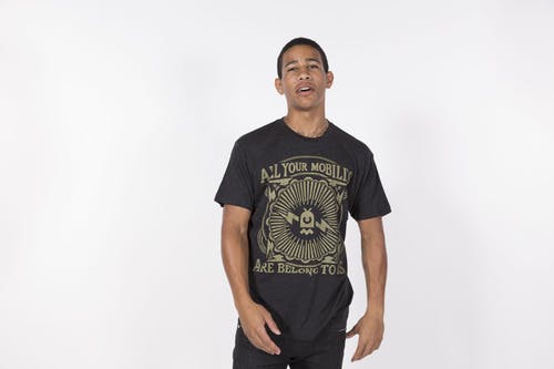 man wearing black t-shirt and gold printing man wearing black t-shirt and gold printing