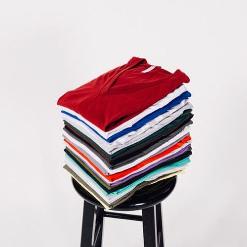 stack of different color v-necks stack of different color v-necks