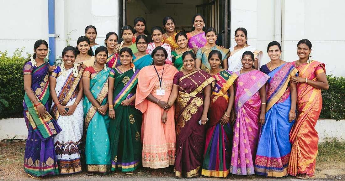 a group of Indian women standing together a group of Indian women standing together