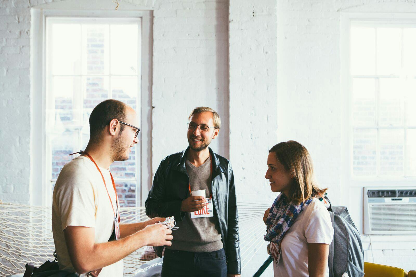 three people talking three people talking