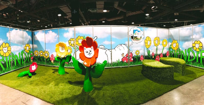 conference booth with turf and flower with cat faces conference booth with turf and flower with cat faces