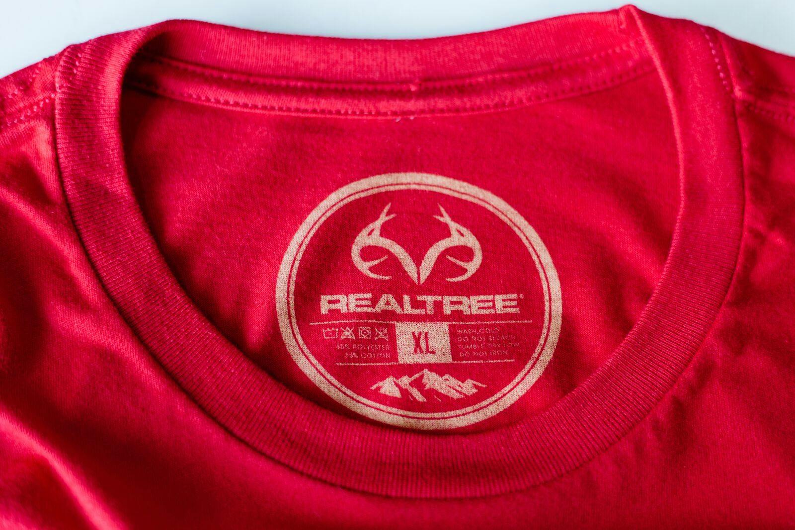 red shirt with a close up of a printed tag red shirt with a close up of a printed tag