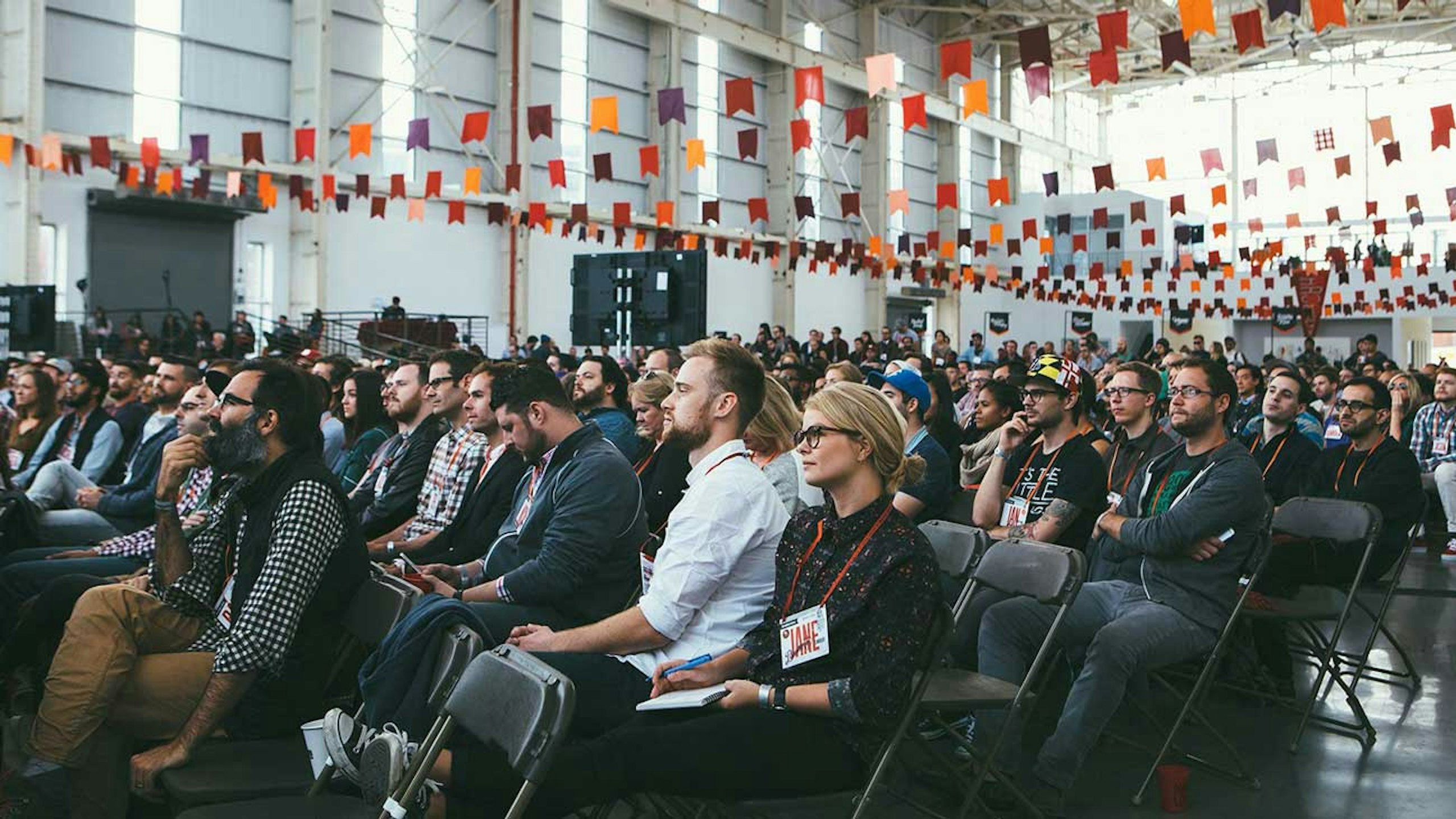 crowd of people sitting in chairs
