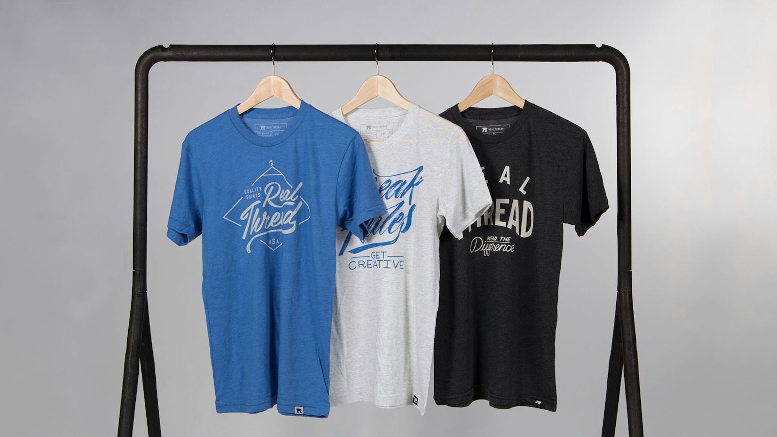 blue, white, and black shirt hanging