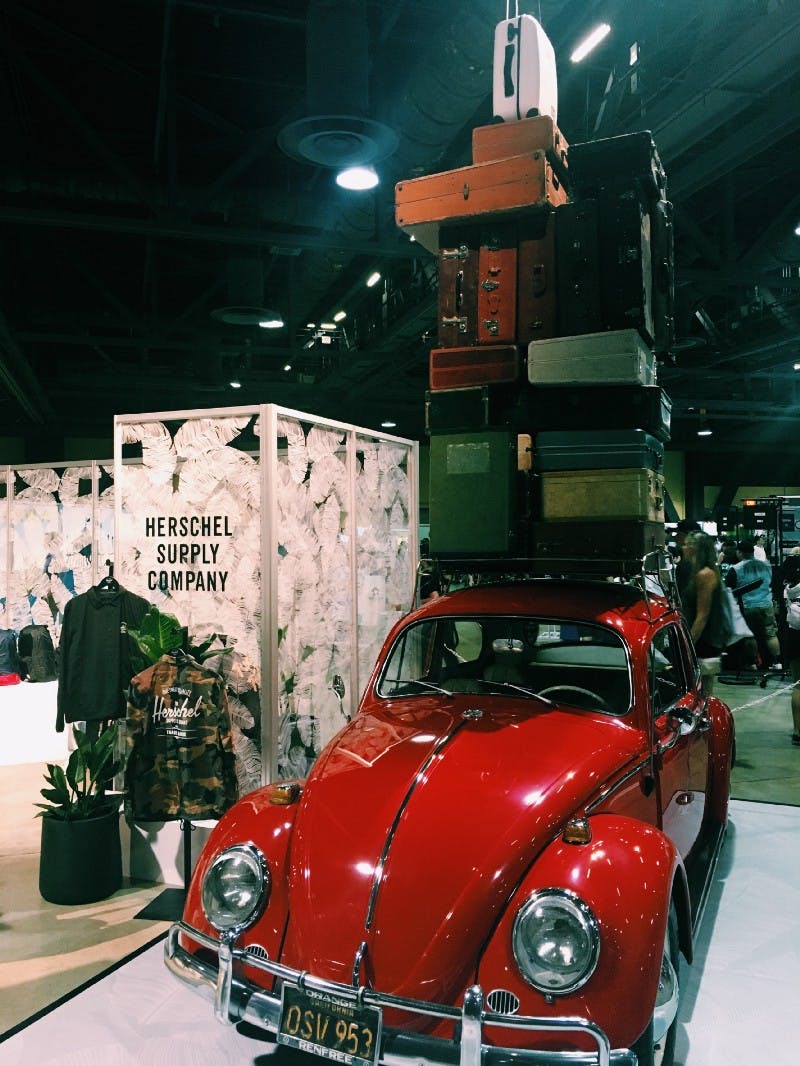 Red VW with suitcases stacked on top Red VW with suitcases stacked on top