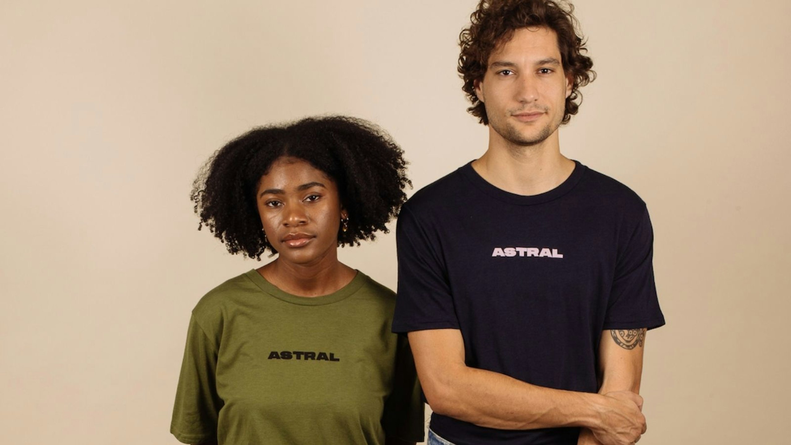 women wearing a olive green shirt and a man wearing a black shirt