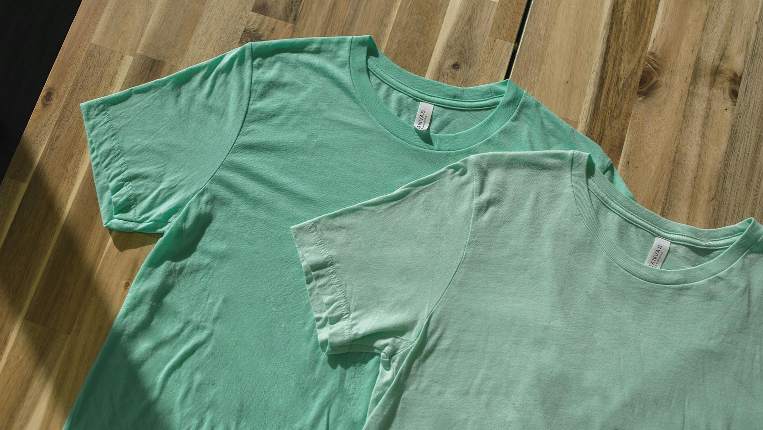 two green shirts over each other