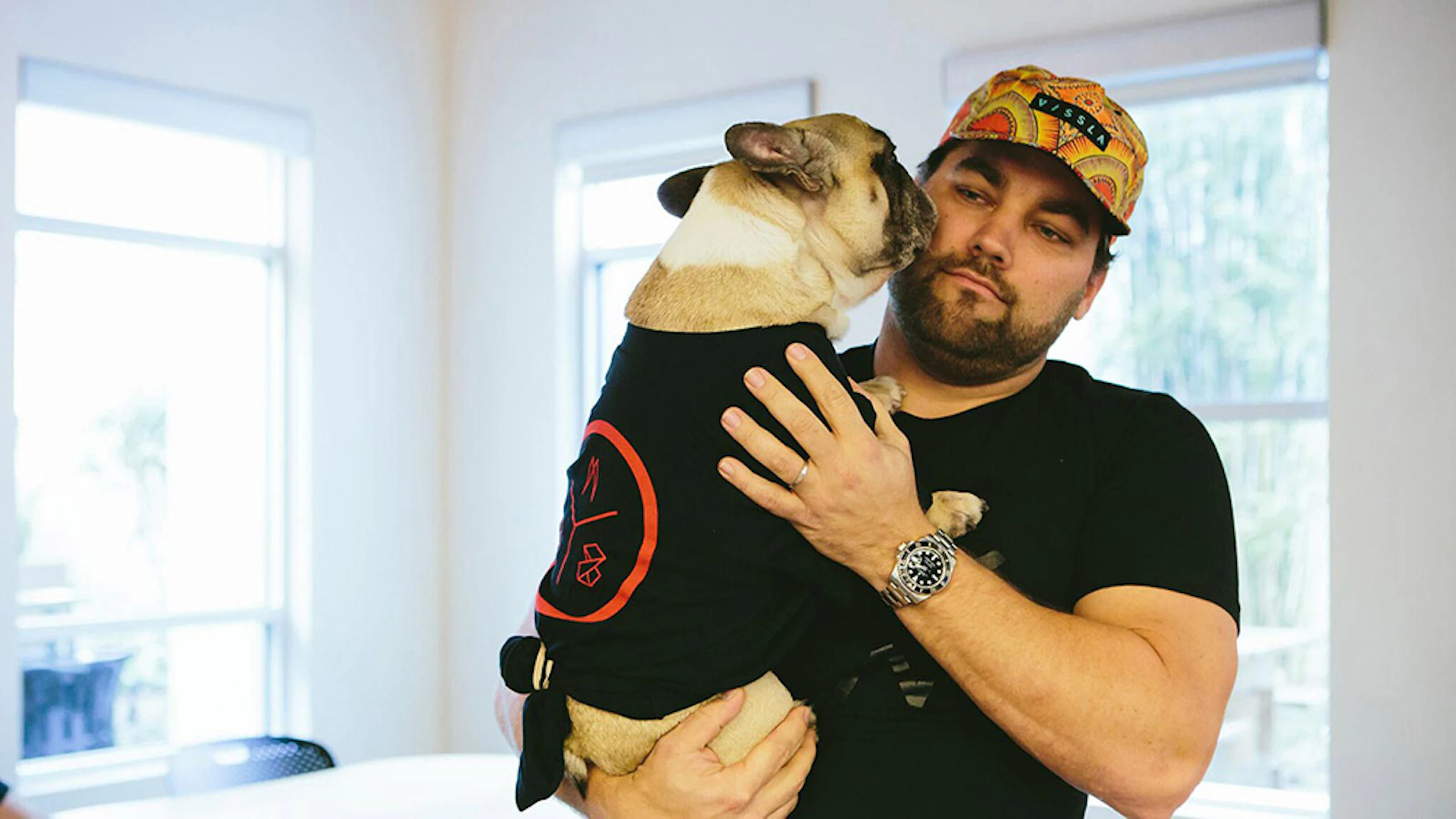 man holding a dog