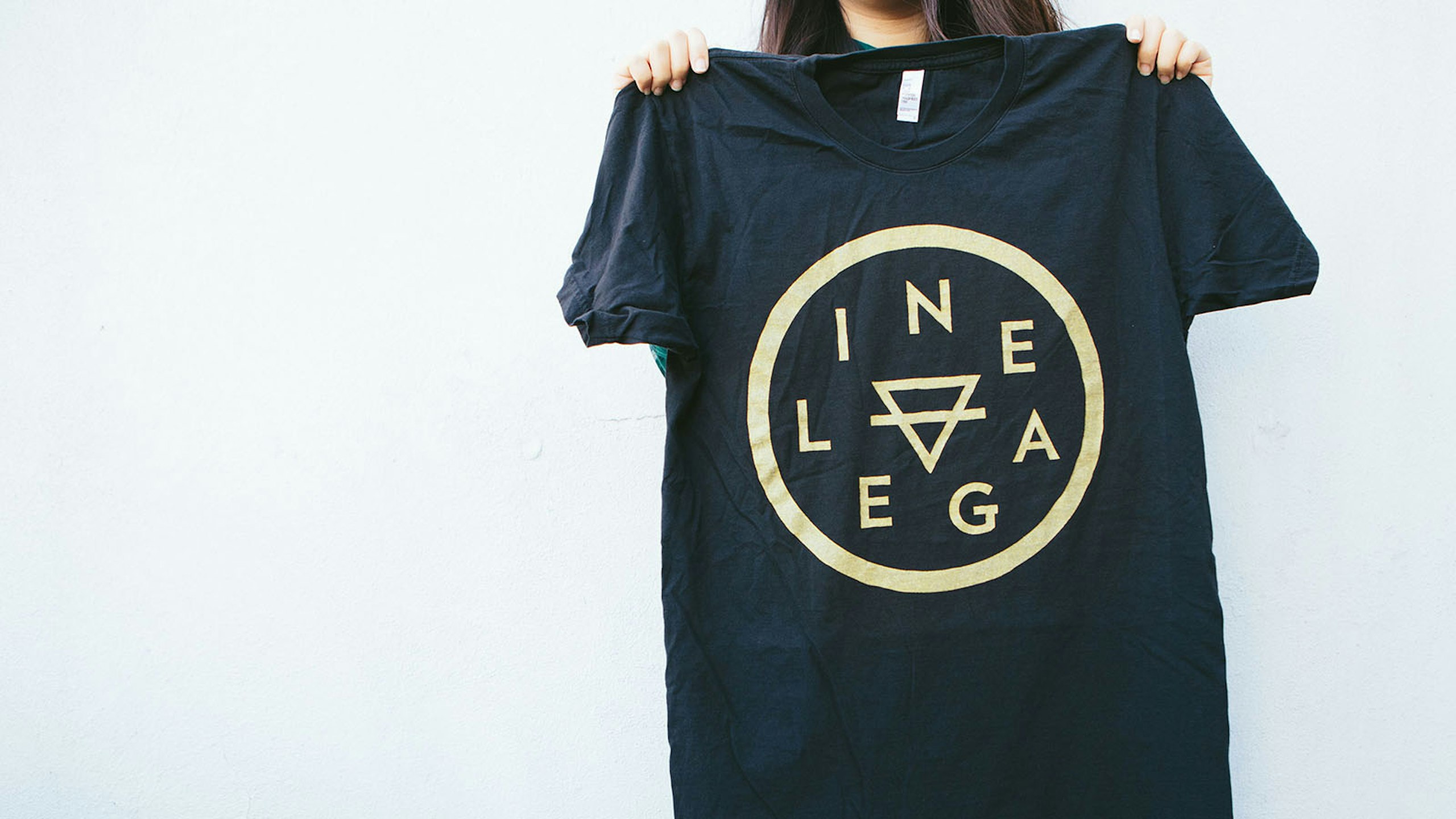 black t-shirt with yellow print