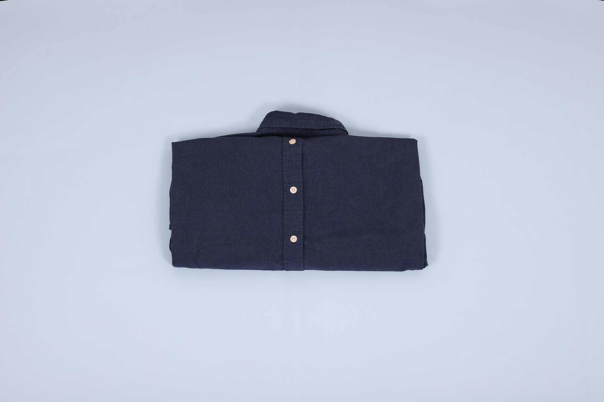 Navy dress shirt folded into thirds facing down Navy dress shirt folded into thirds facing down
