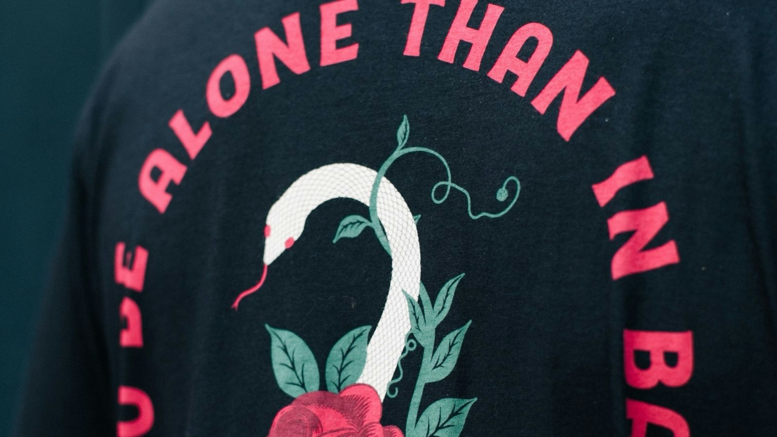 close up of a black t-shirt with red print