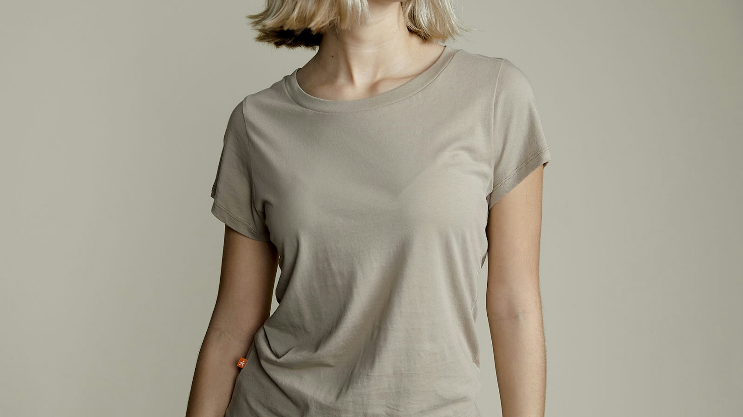 women wearing a green-gray t-shirt