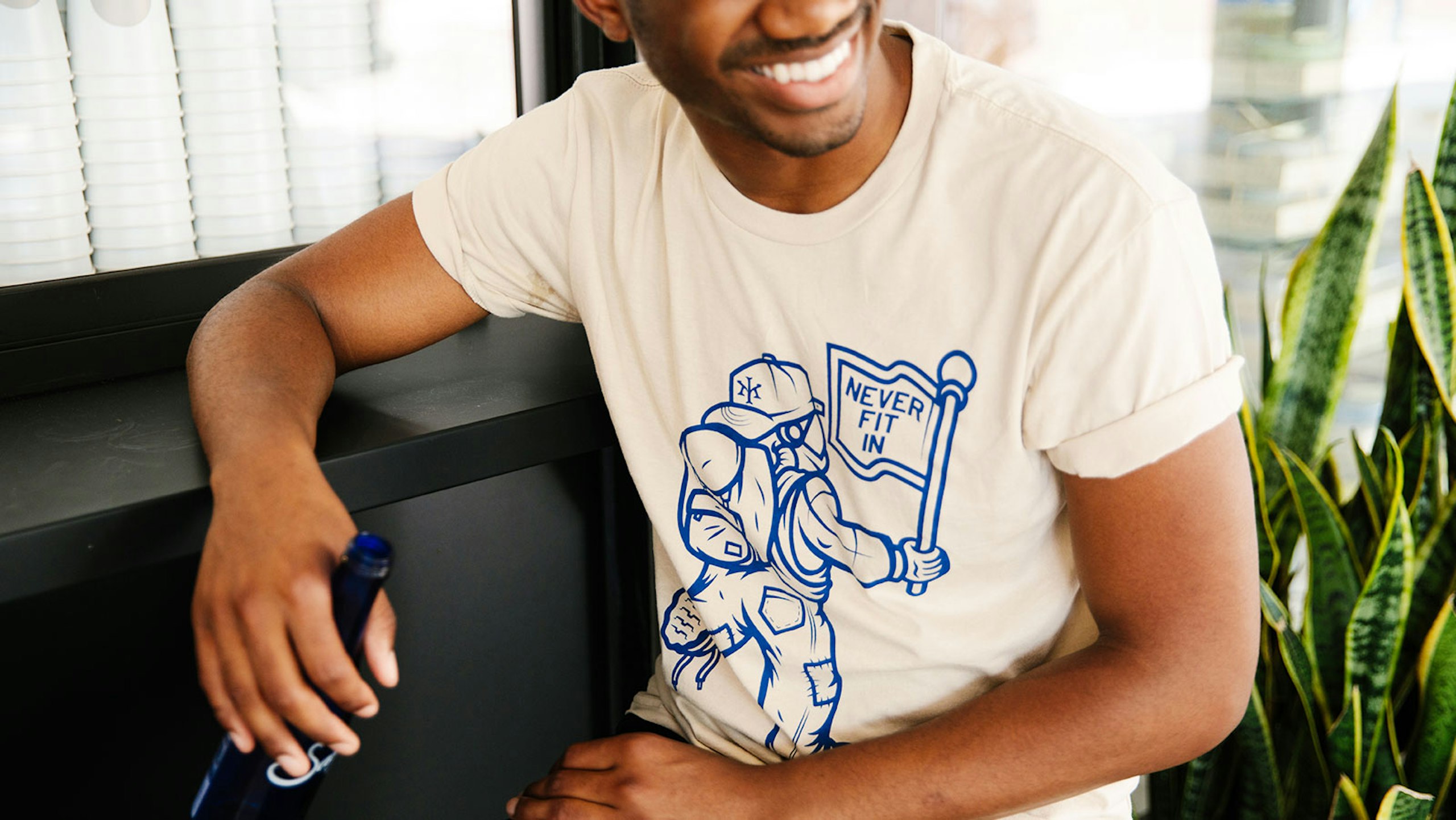 man wearing a cream white t-shirt