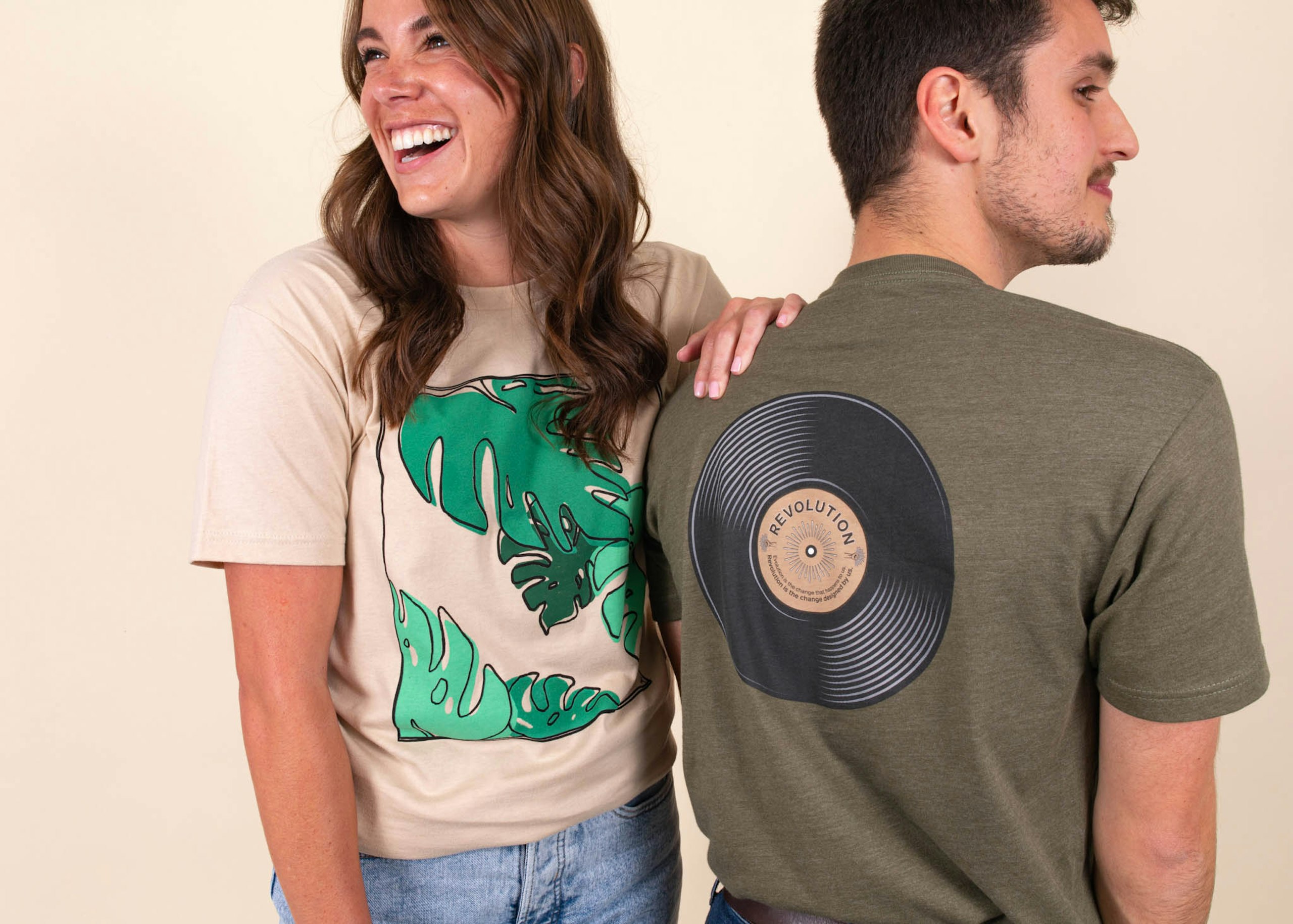 women wearing a cream color shirt and a man wearing an dark green shirt