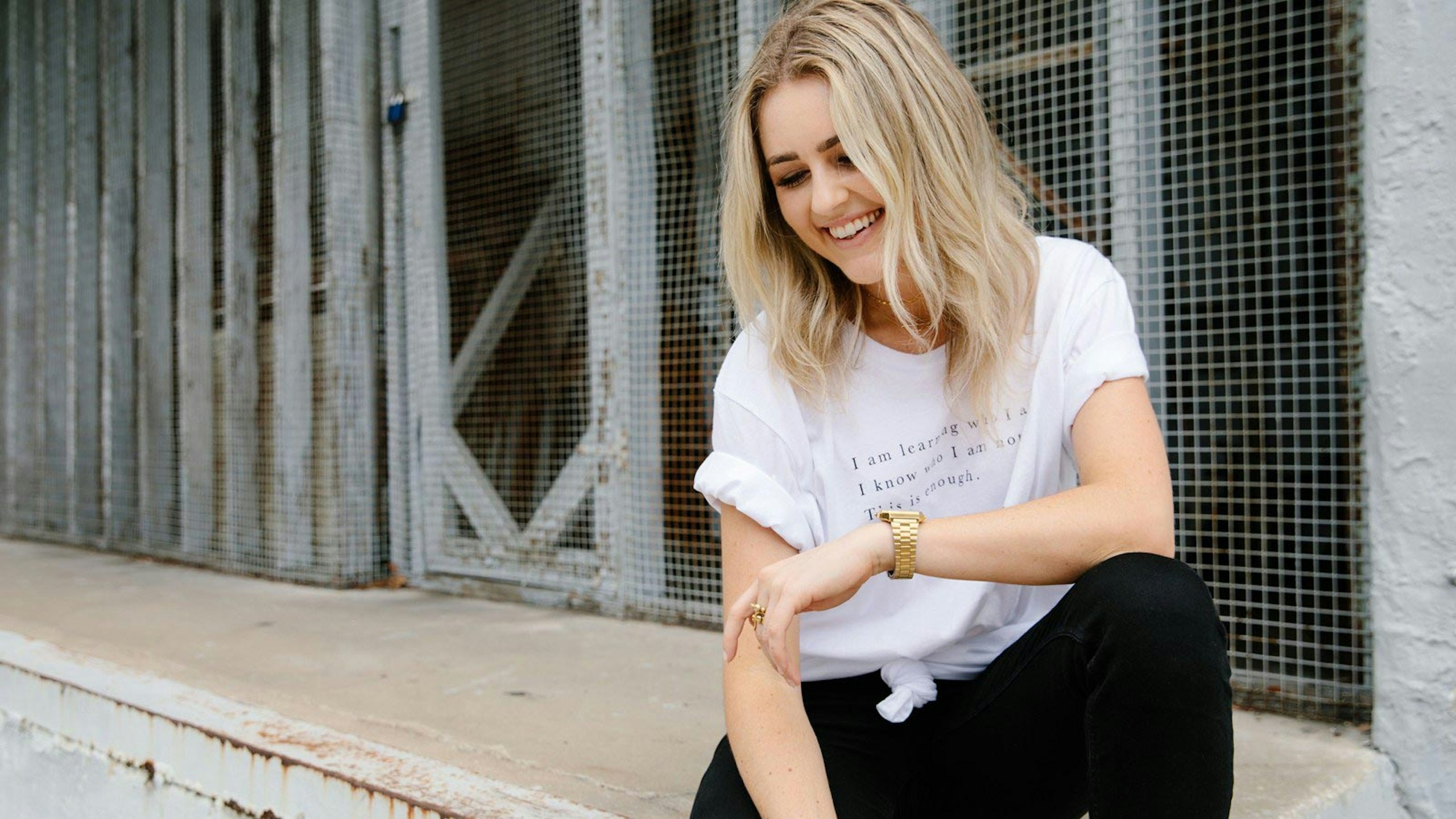 women with a white t-shirt and black pants