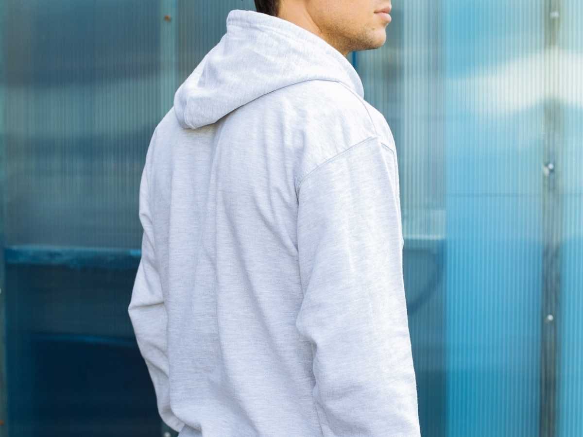 The back of a gray hoodie. The back of a gray hoodie.