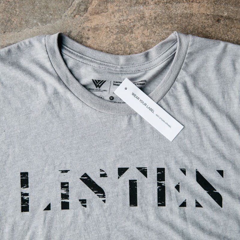 hang tag on a gray shirt hang tag on a gray shirt