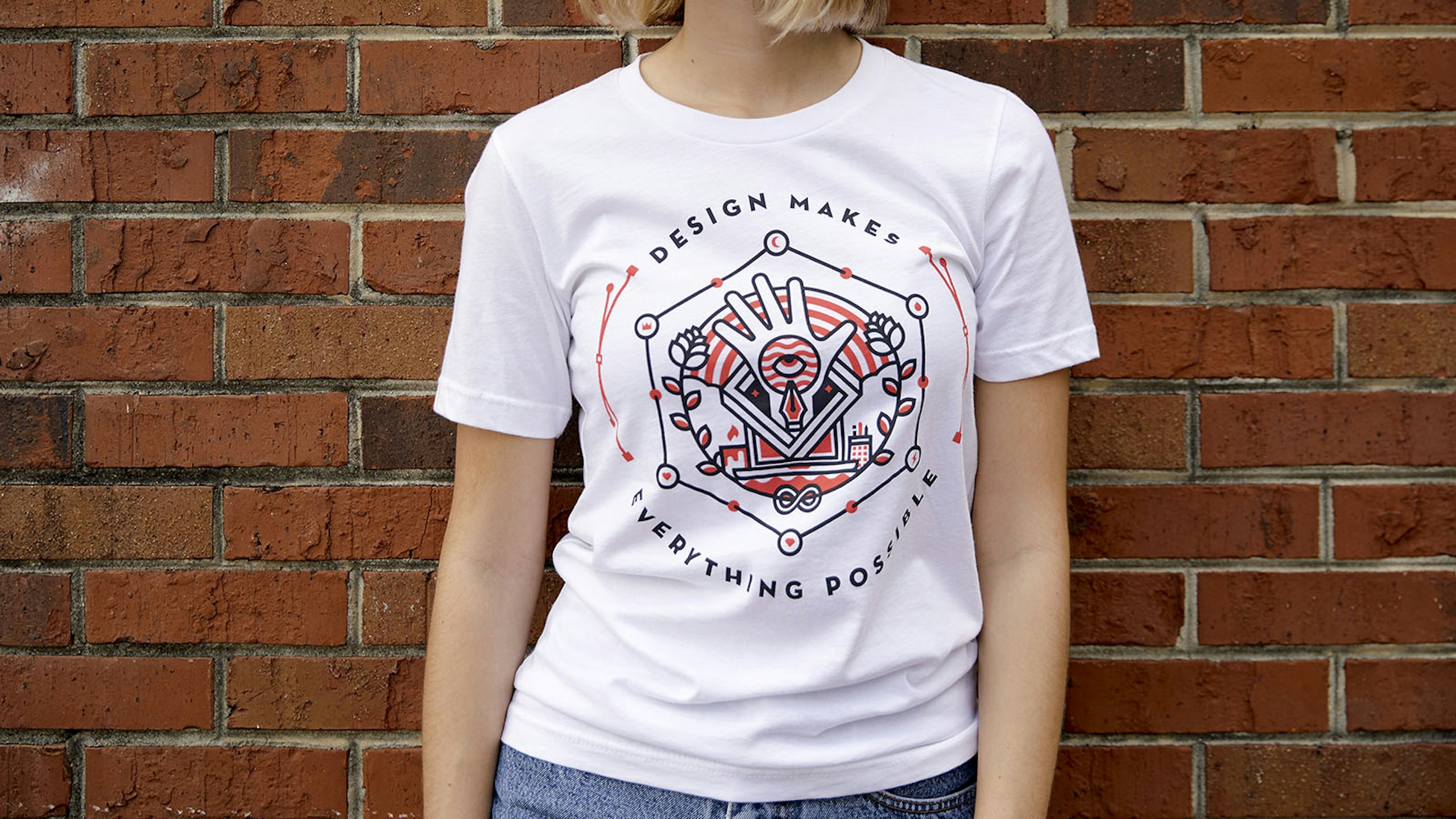 women wearing a white shirt with a black and red design