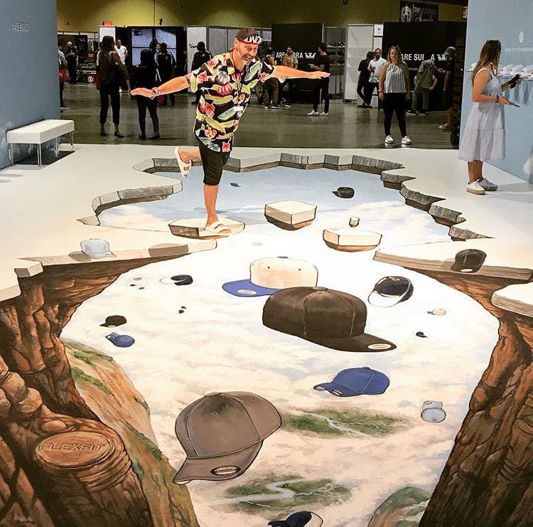 painted floor with rock walls on either side with hats fulling in the center painted floor with rock walls on either side with hats fulling in the center