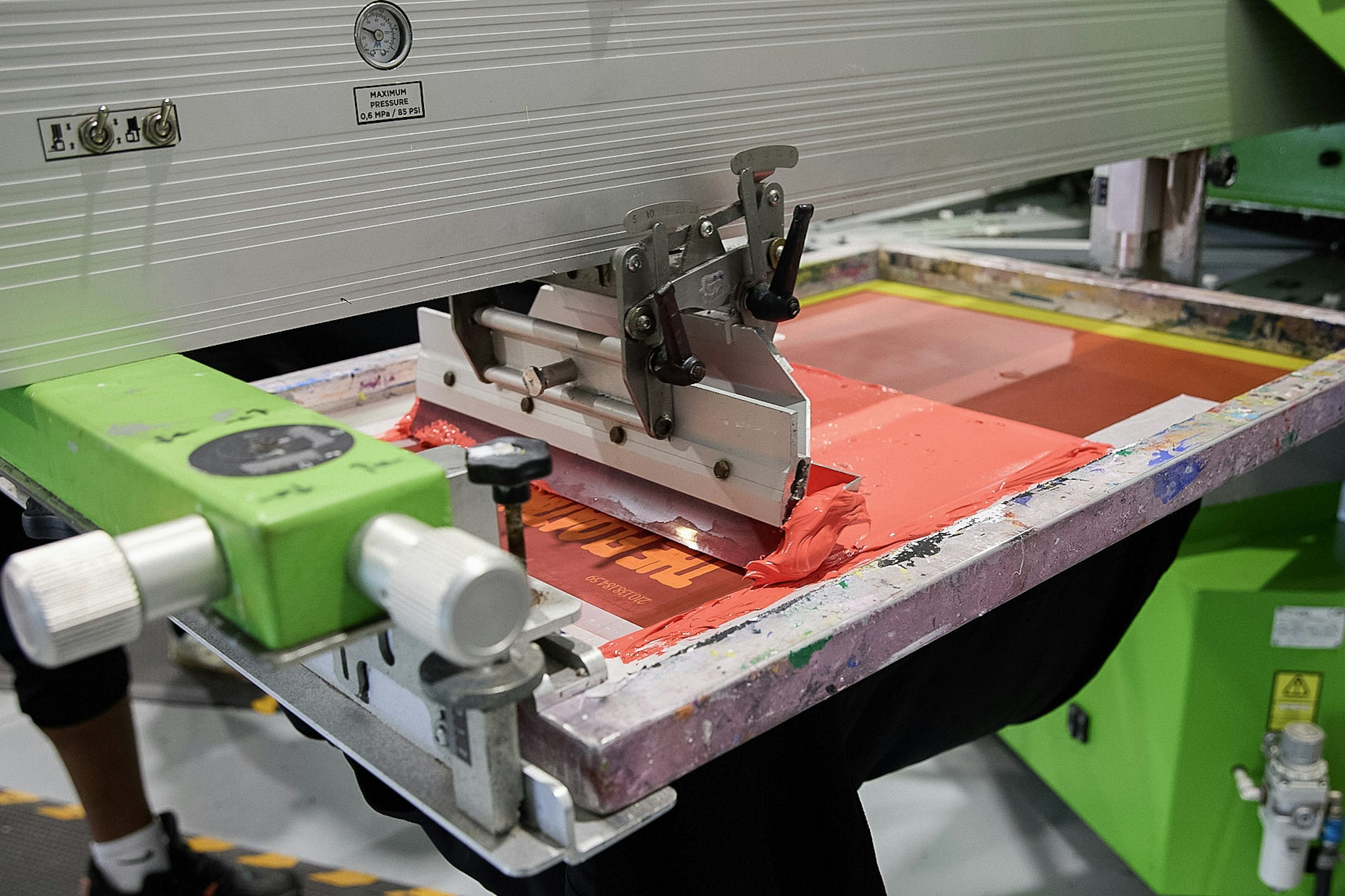 red ink on a screen press