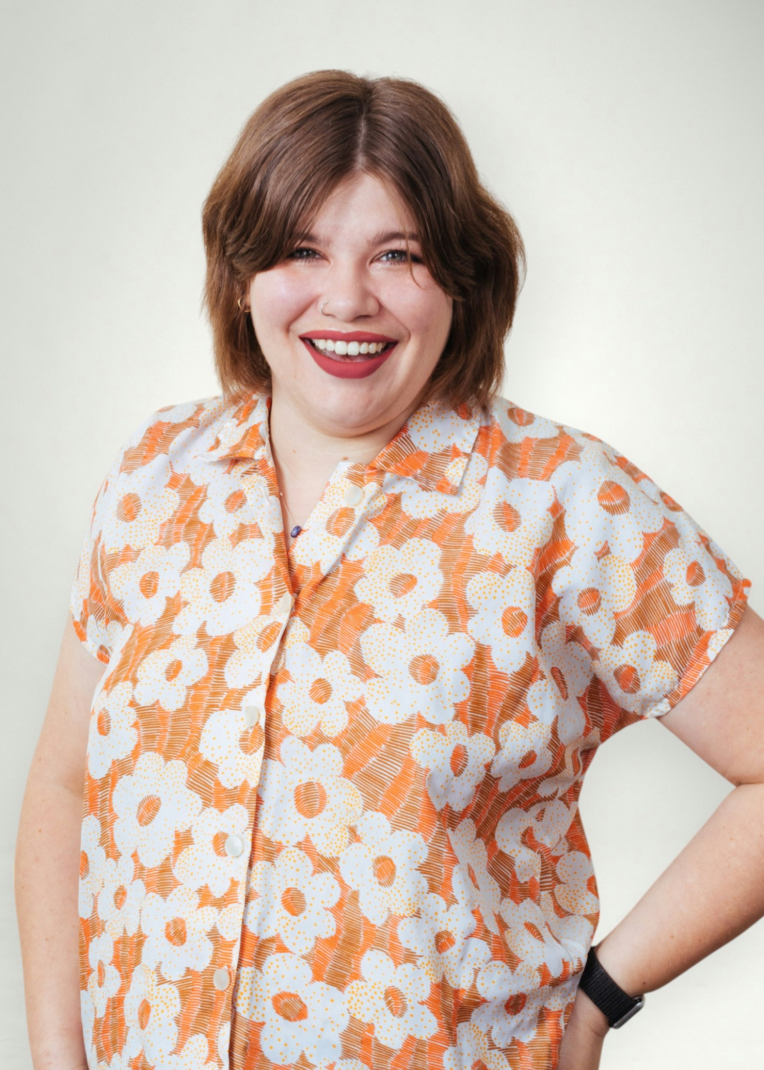 Hannah poses in front of white background