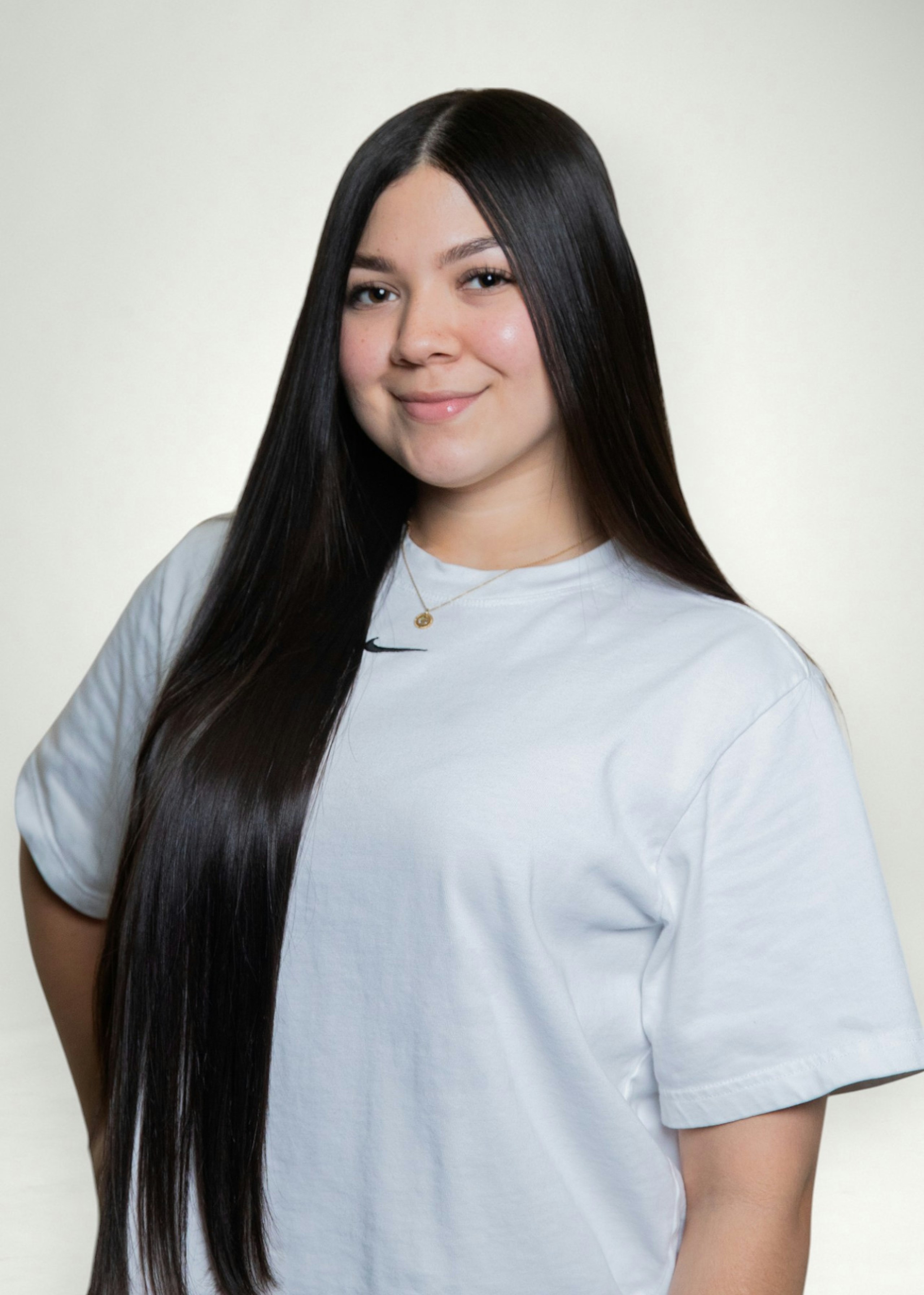 Geraldine poses in front of white background