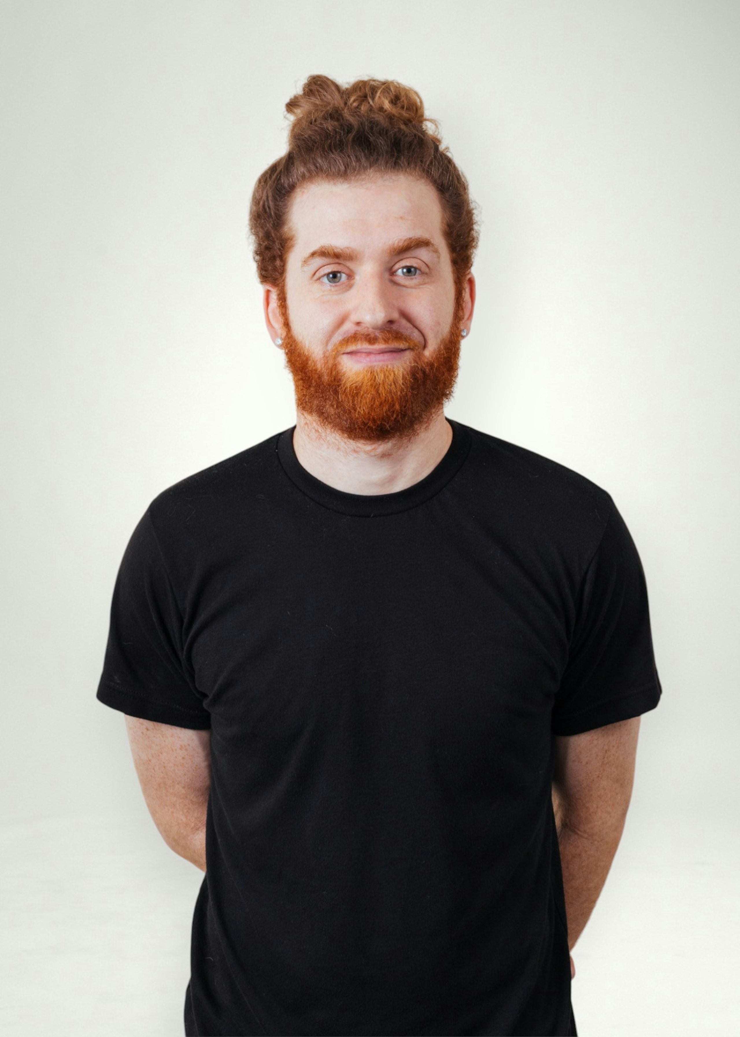Jeremiah poses in front of white background