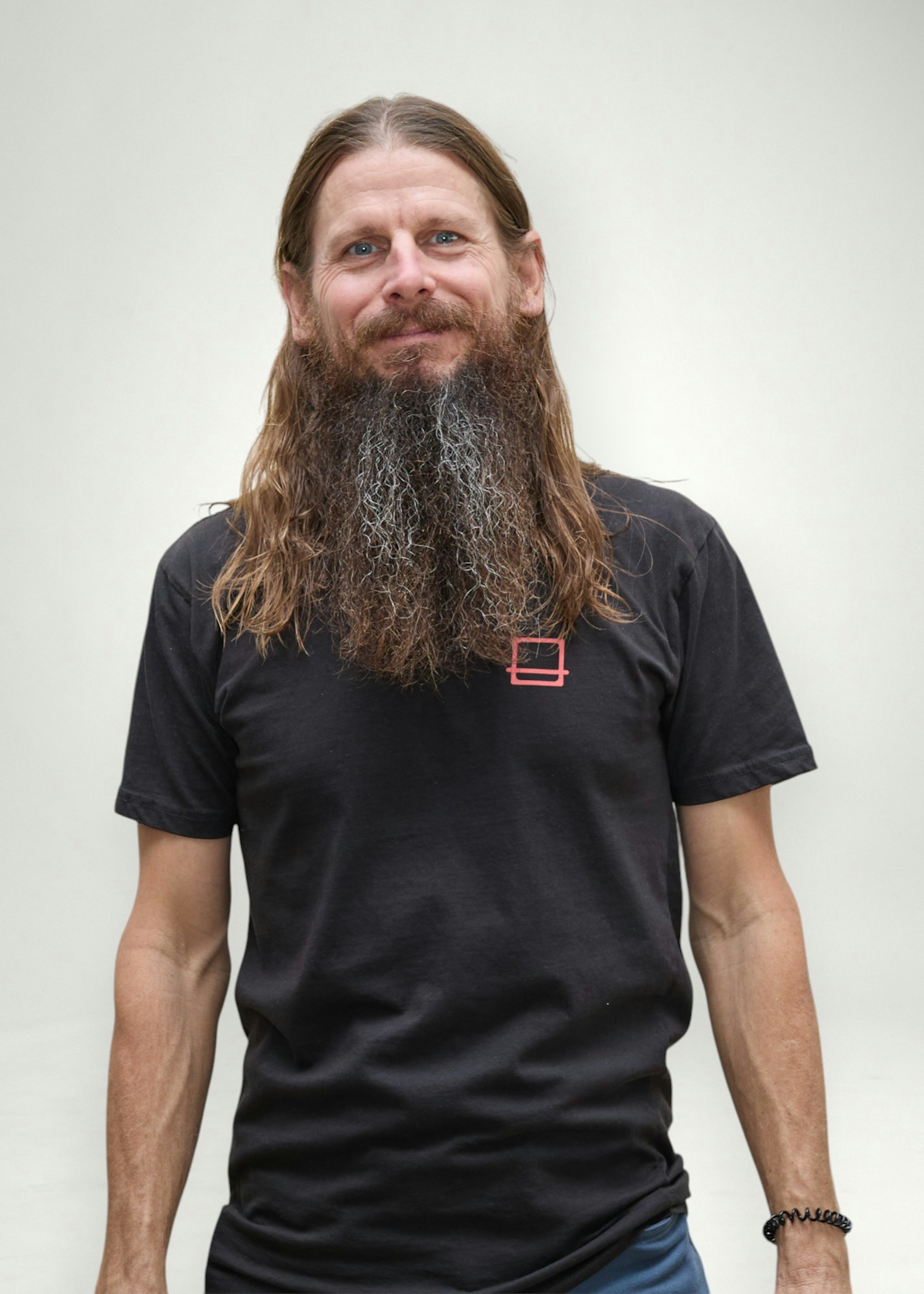Jeremy poses in front of white background