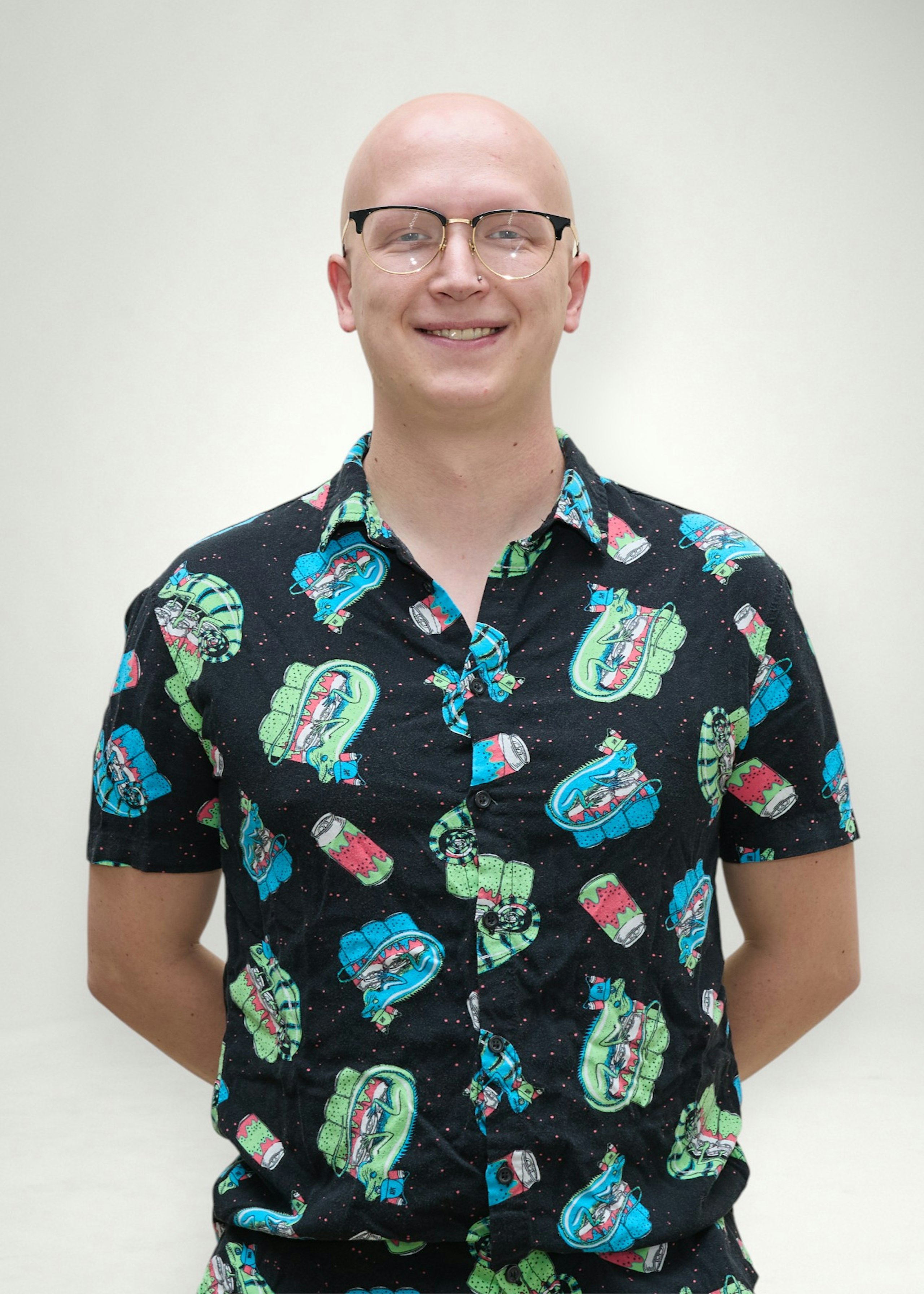 Caleb poses in front of white background