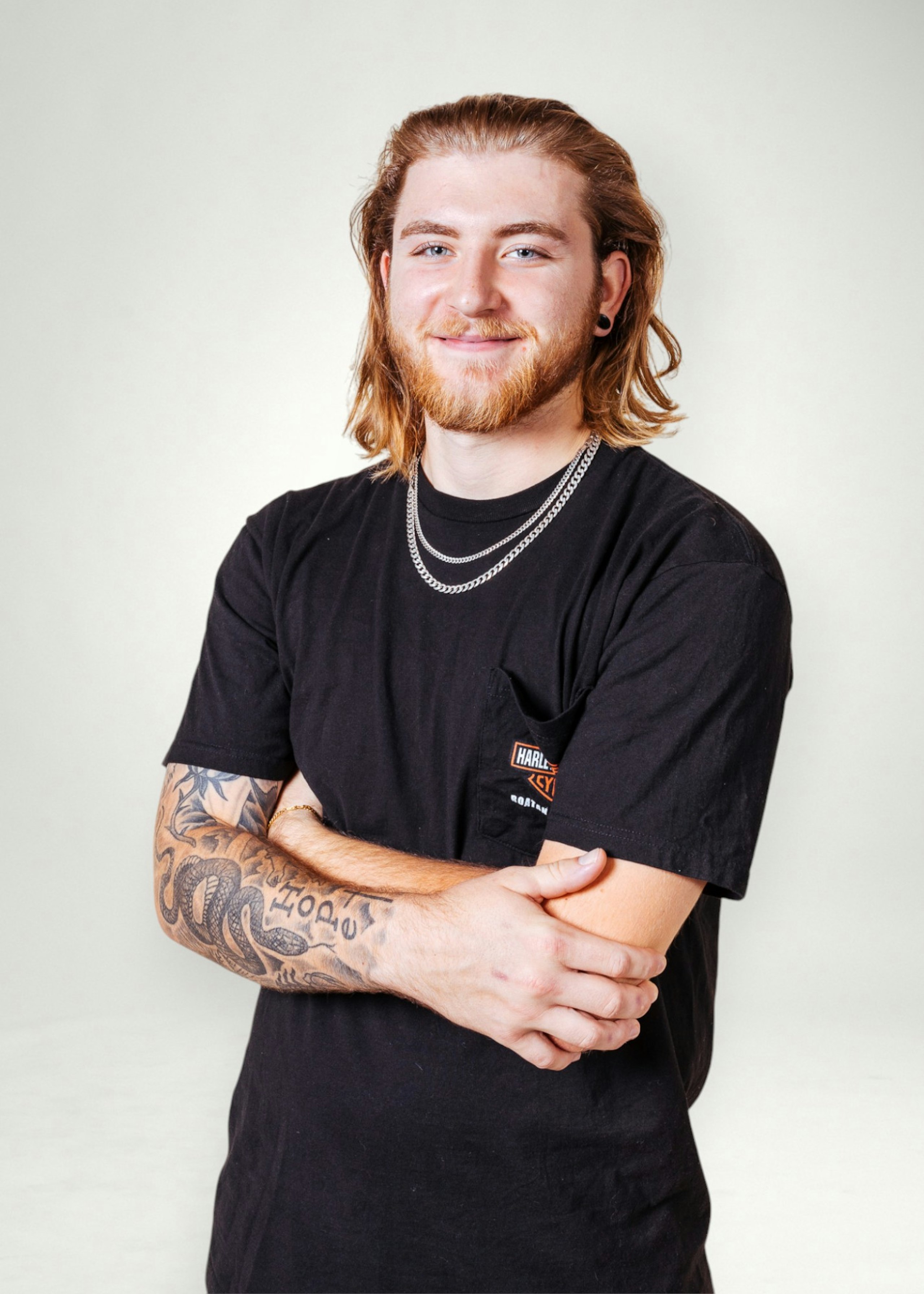 Mikey poses in front of white background