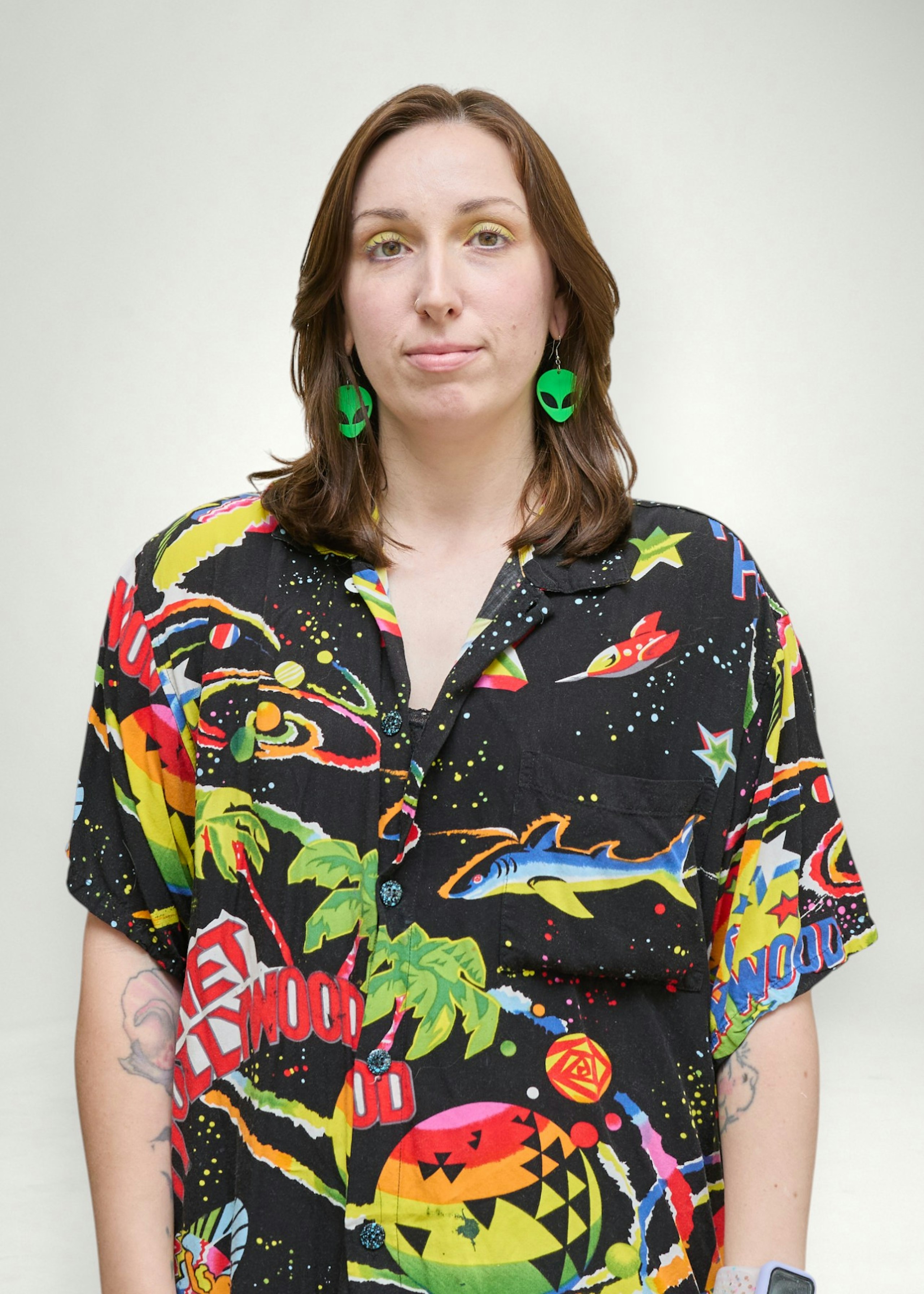 natalie poses in front of white background