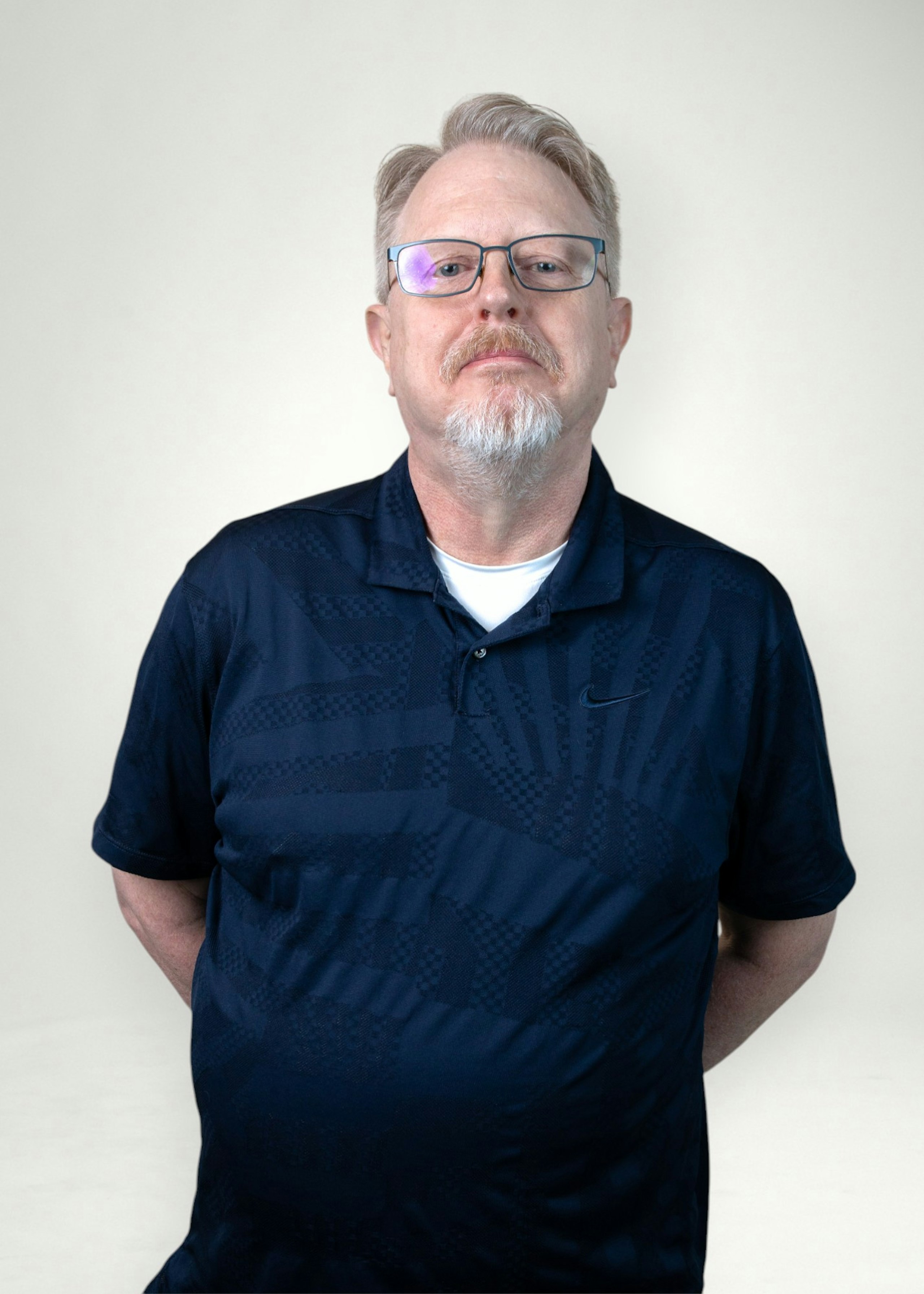 Walt poses in front of white background