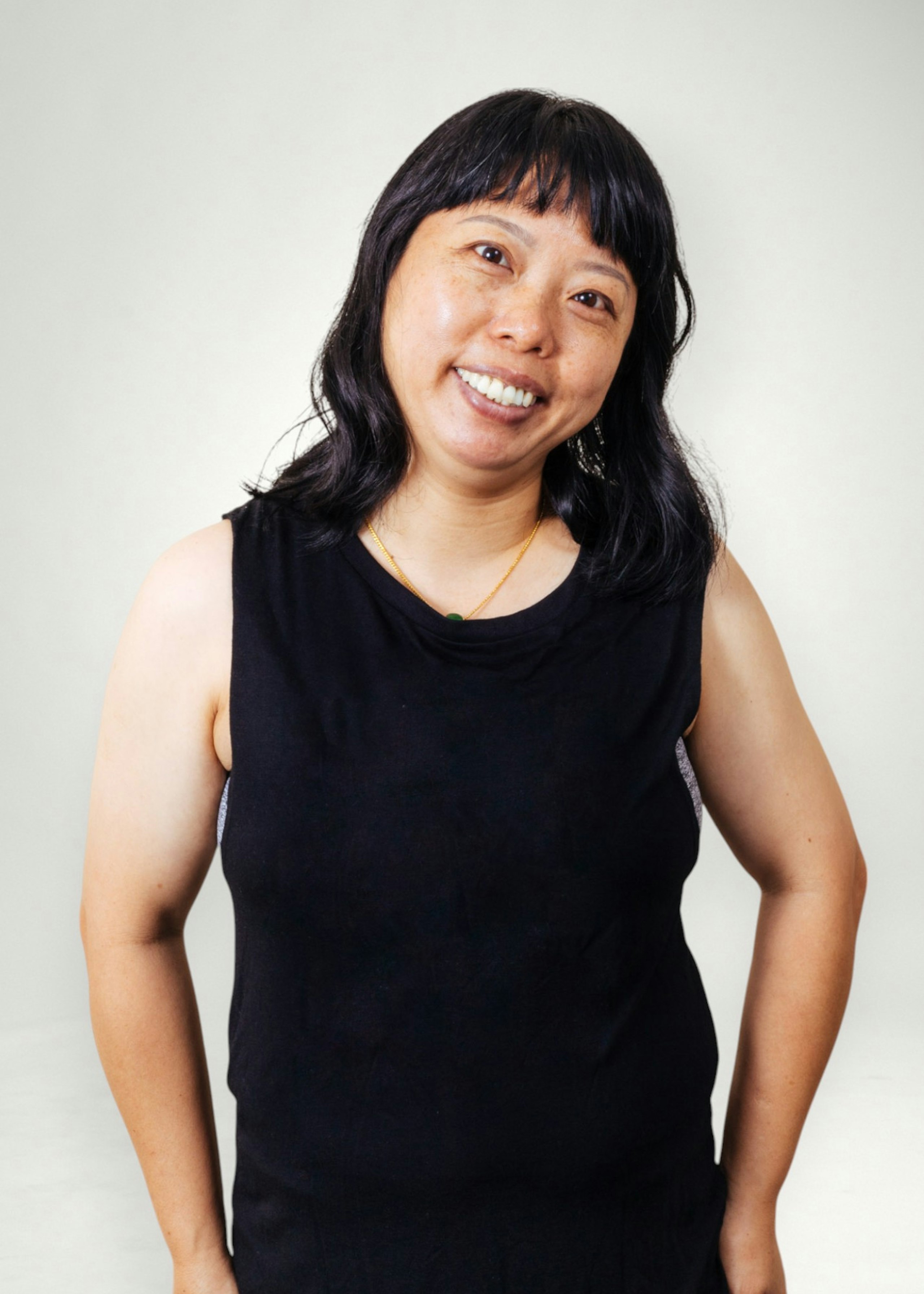Yuchan poses in front of white background