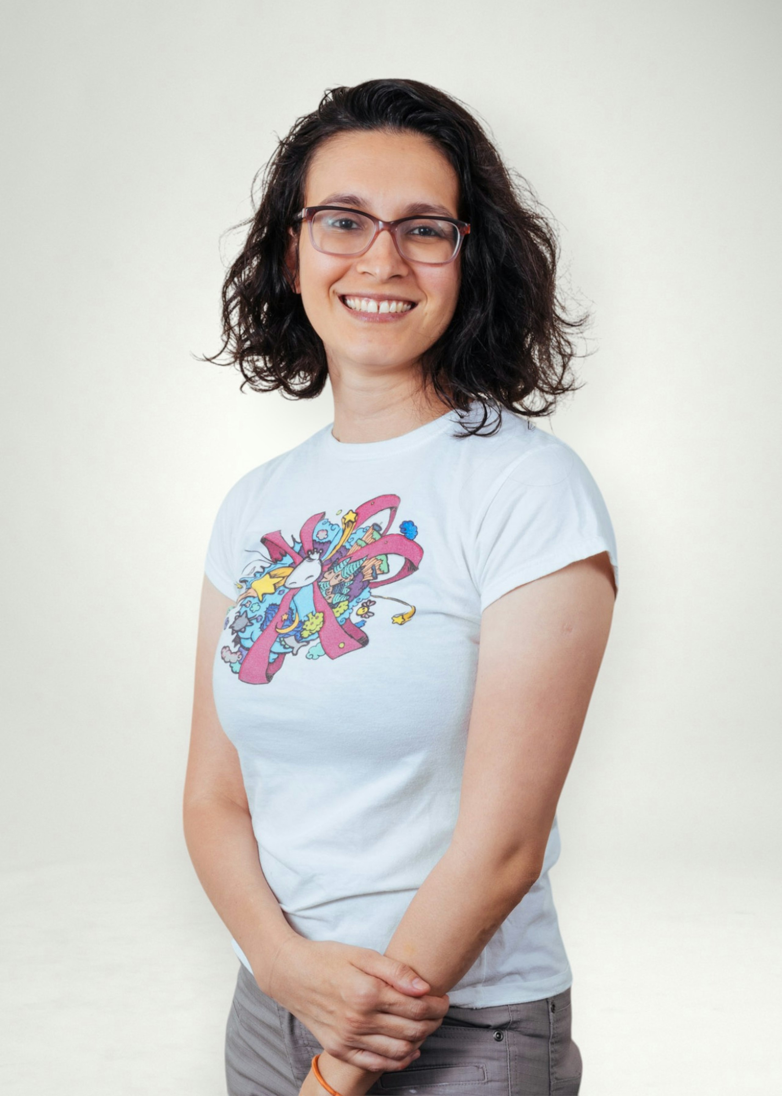 Marcia poses in front of white background
