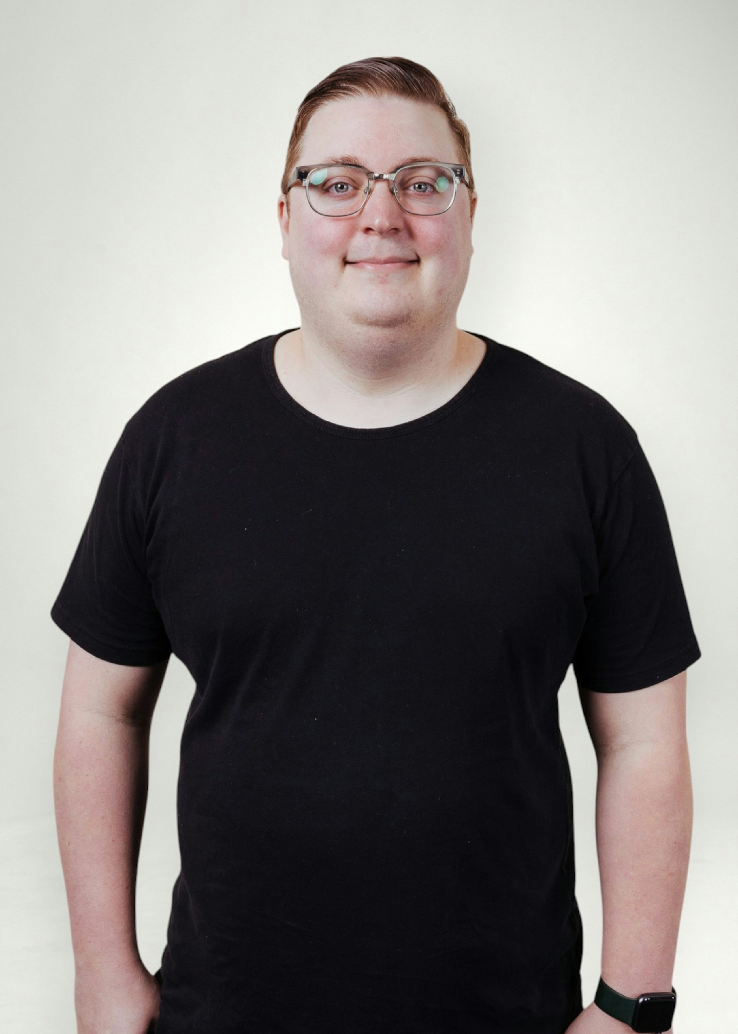 Ian poses in front of white background