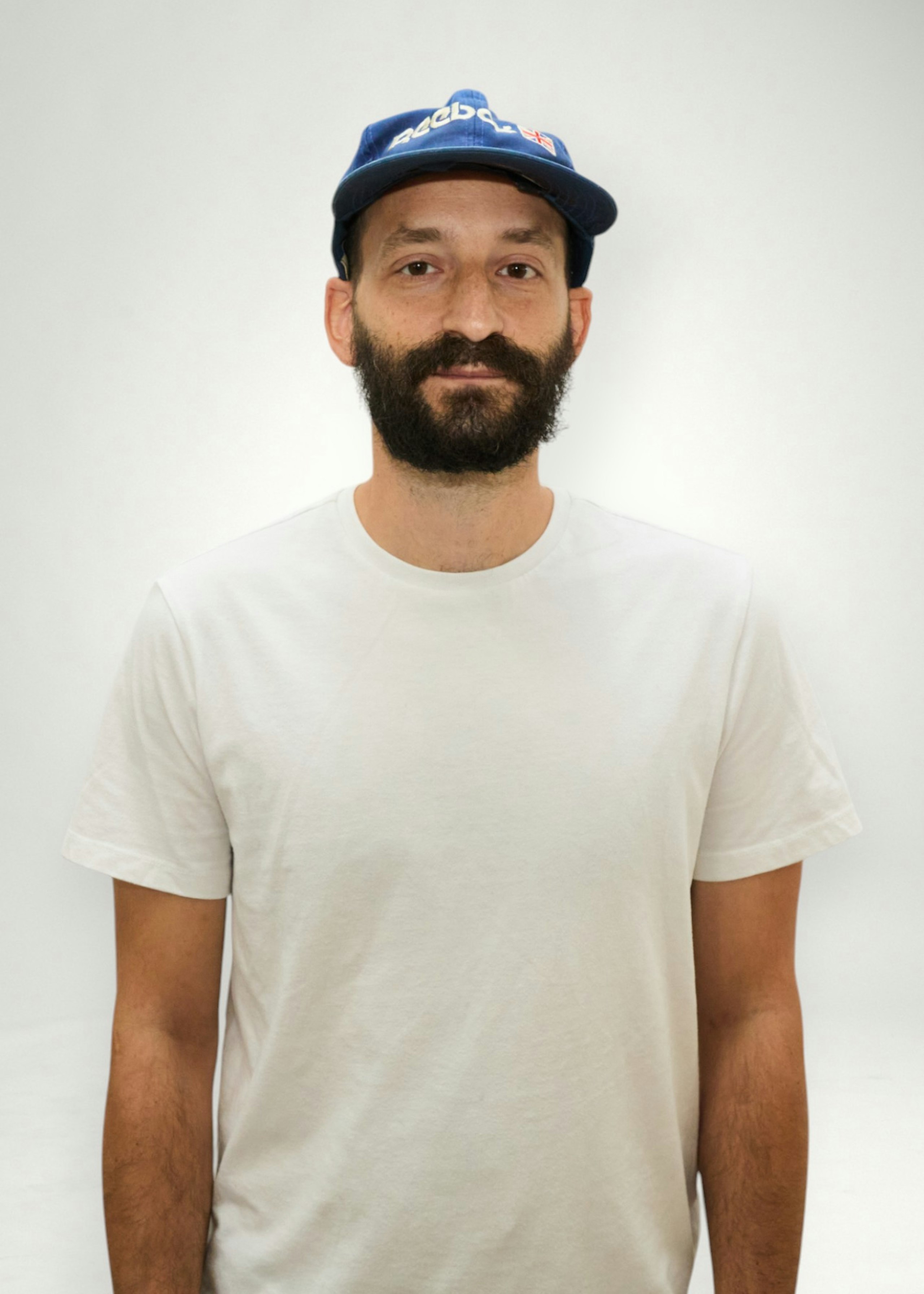 Taylor poses in front of white background