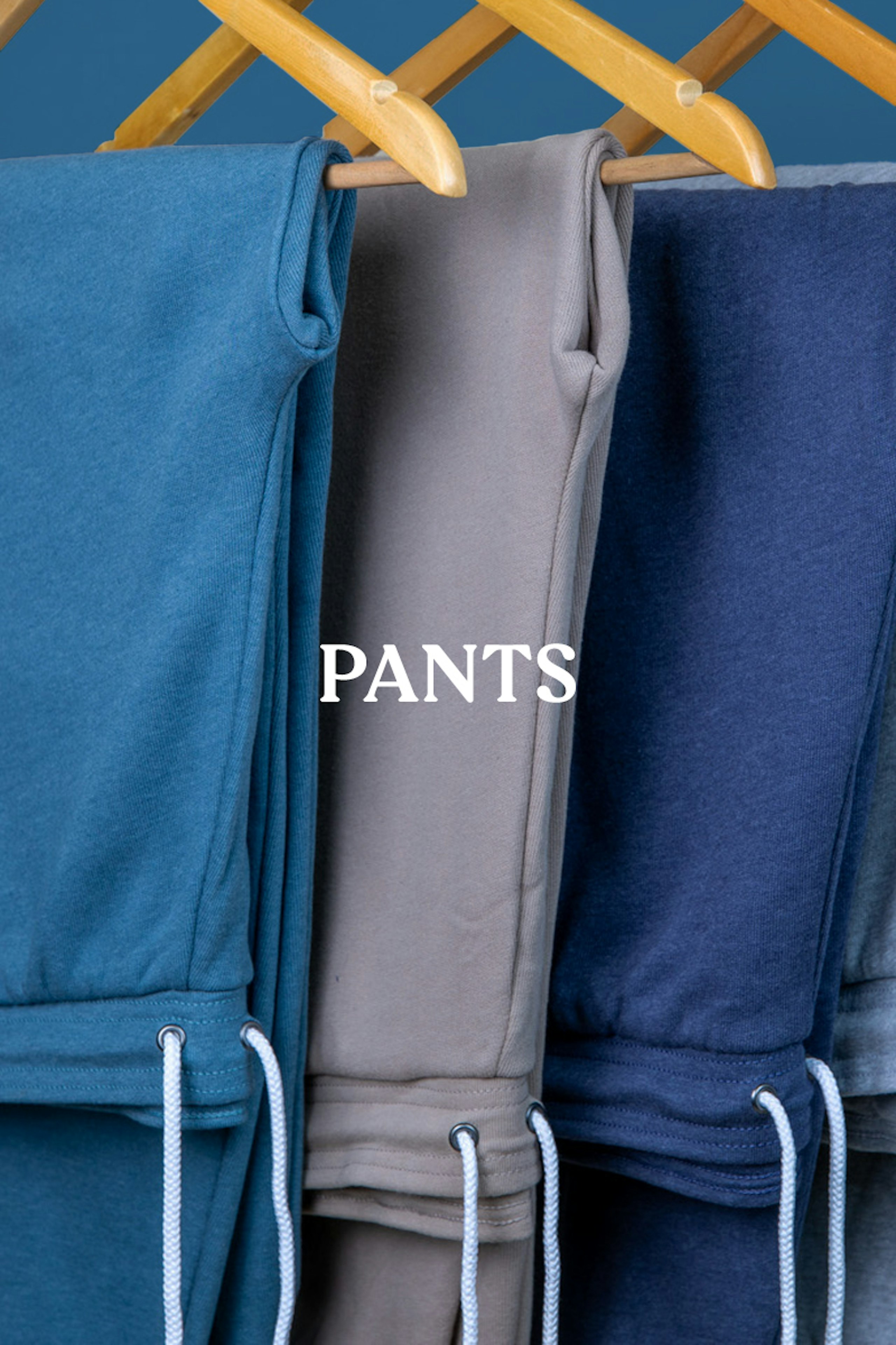 pants, pants folded in a stack with the word pants