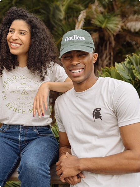 man wearing a white tee with a spartans logo printed on the shirt