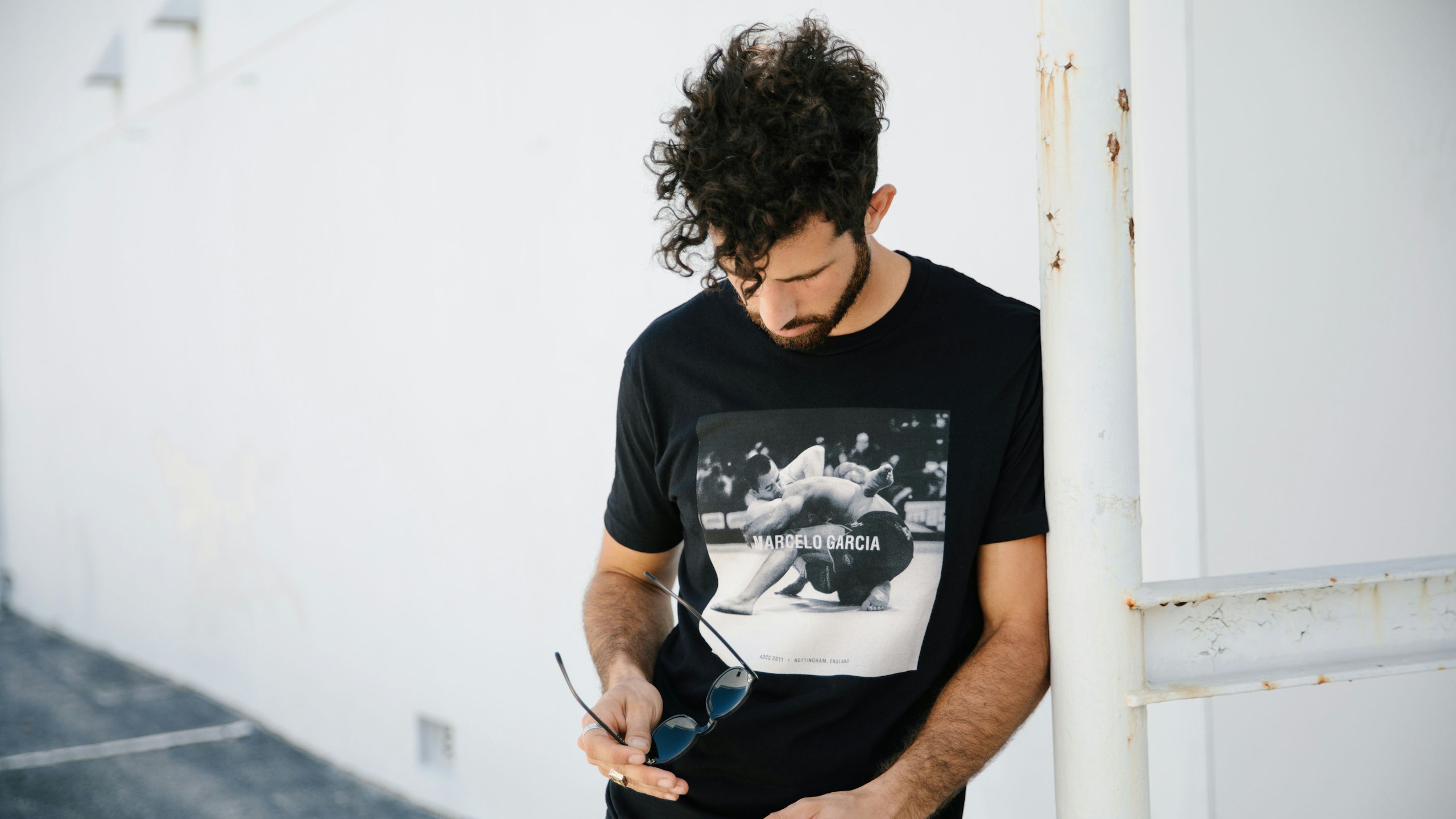 man wearing a black t-shirt a black and white photorealistic print