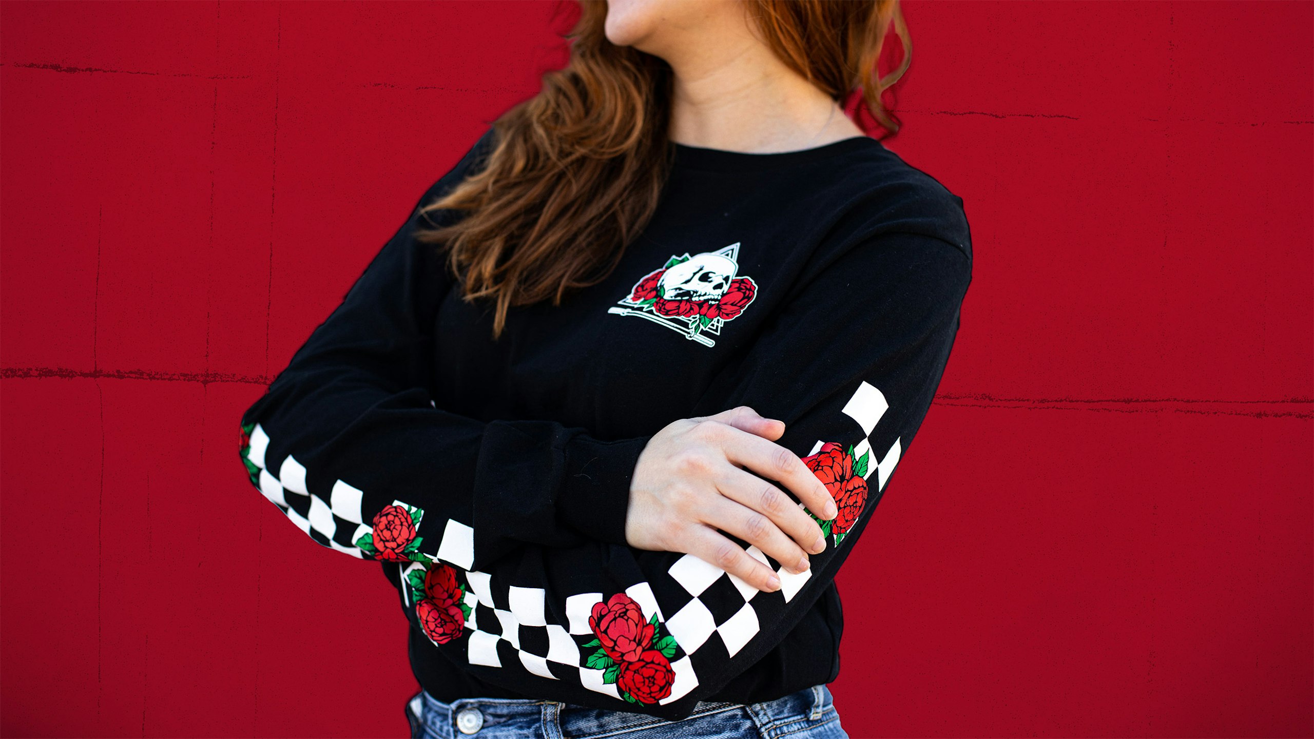 women with a black long-sleeve t-shirt with a sleeve checker print with roses