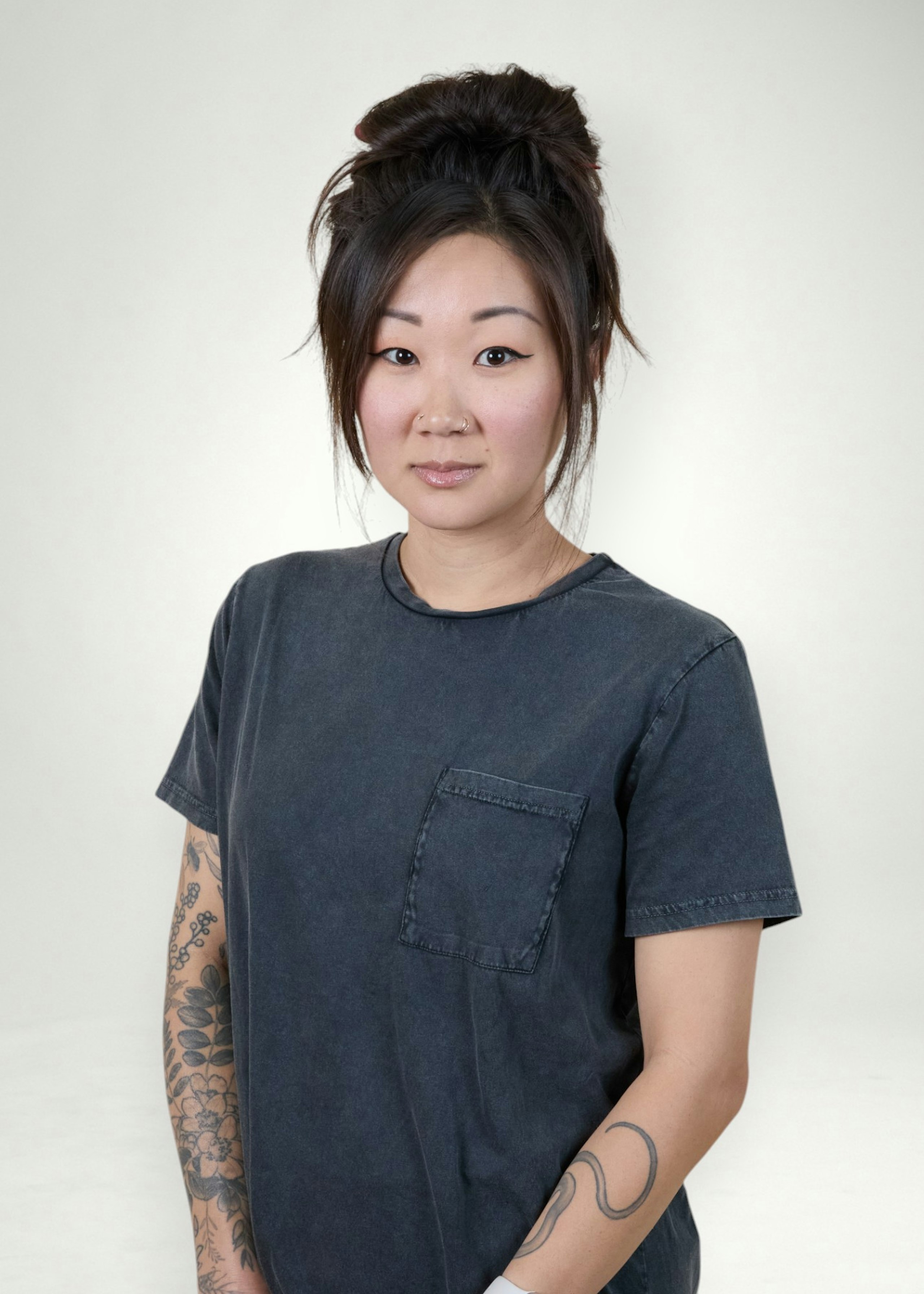 Holly poses in front of white background