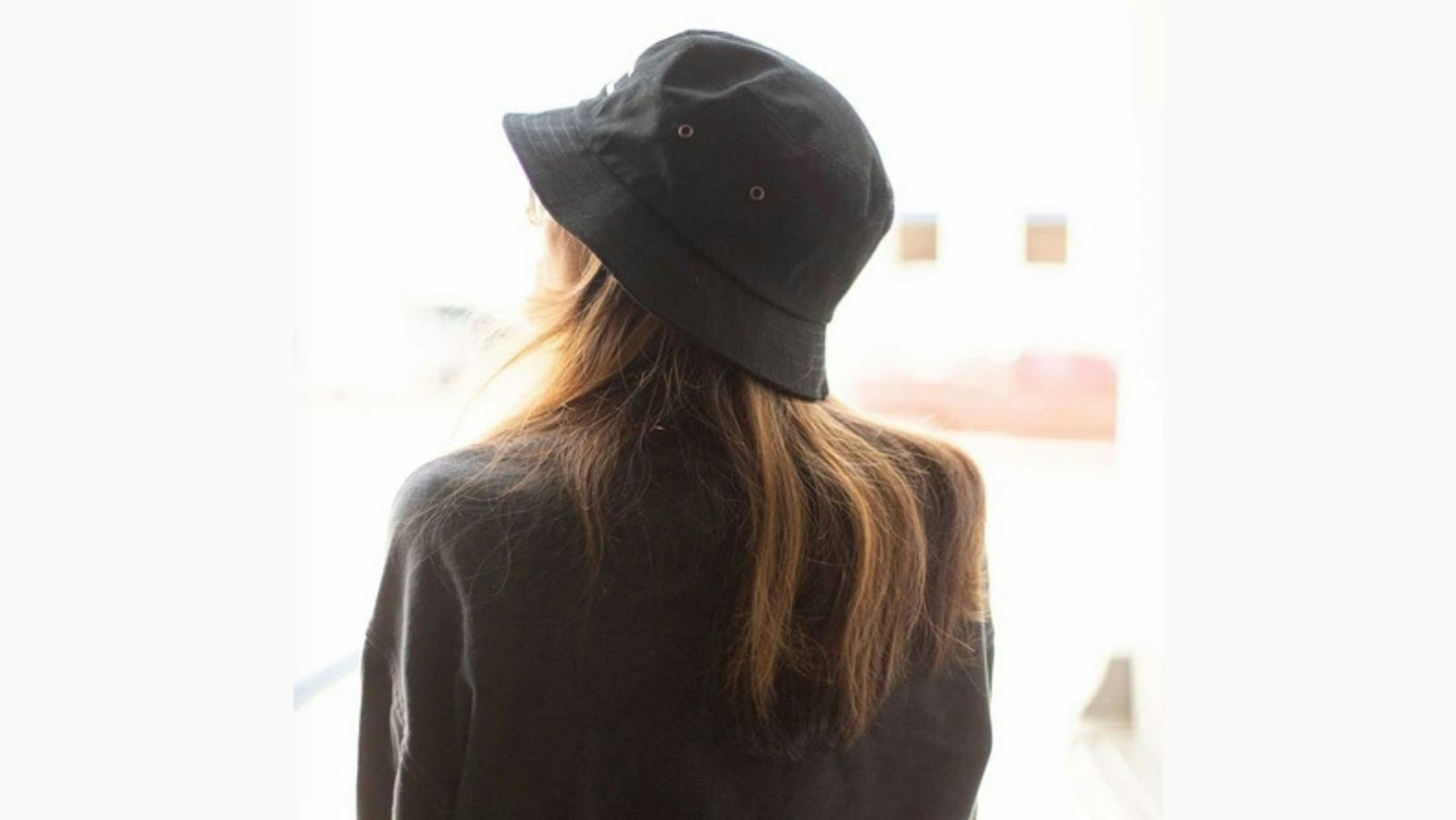 women wearing a black bucket hat