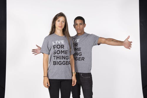 two people wearing a gray shirt in a photo two people wearing a gray shirt in a photo