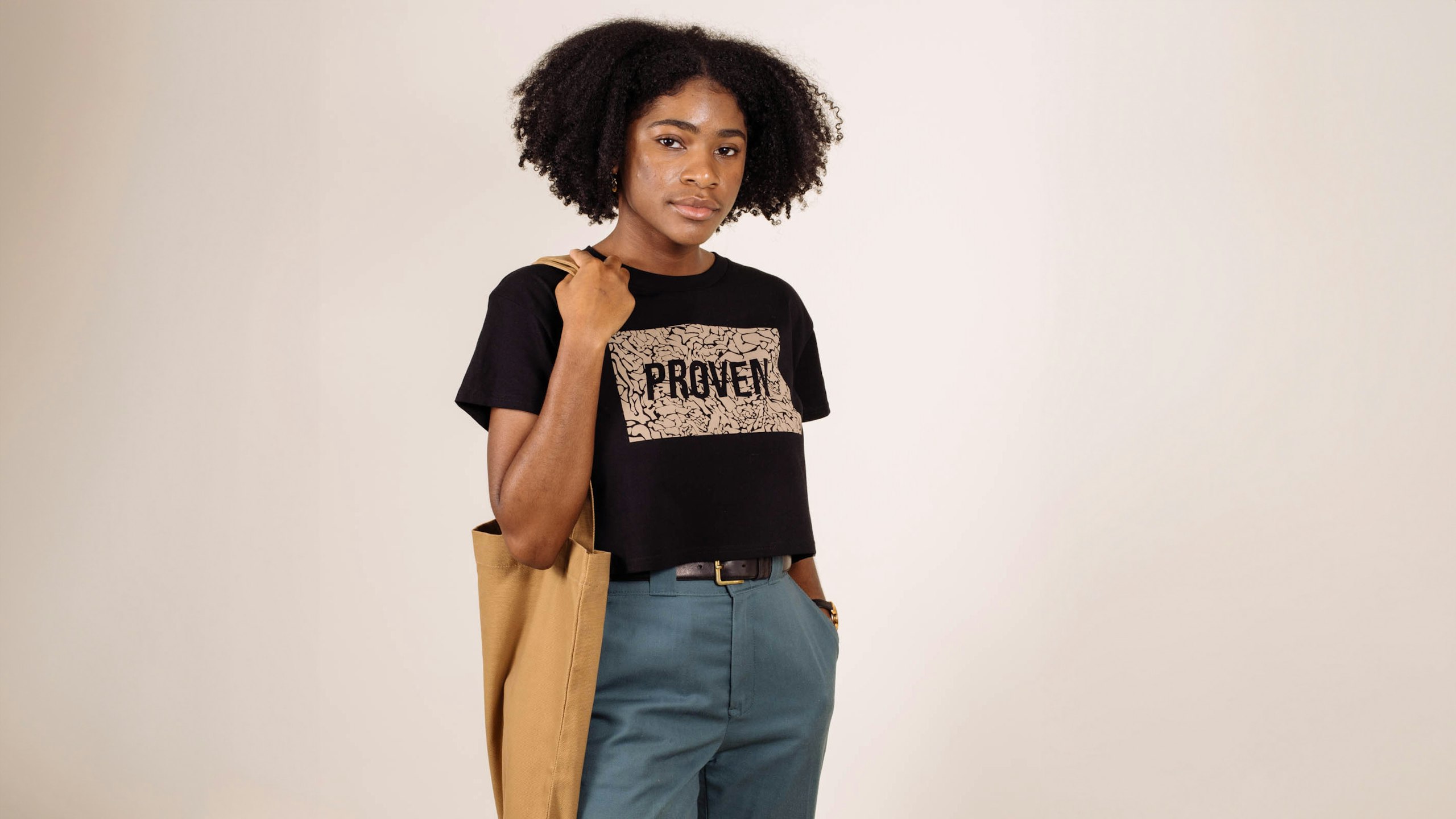 women wearing a black shirt holding a yellow bag