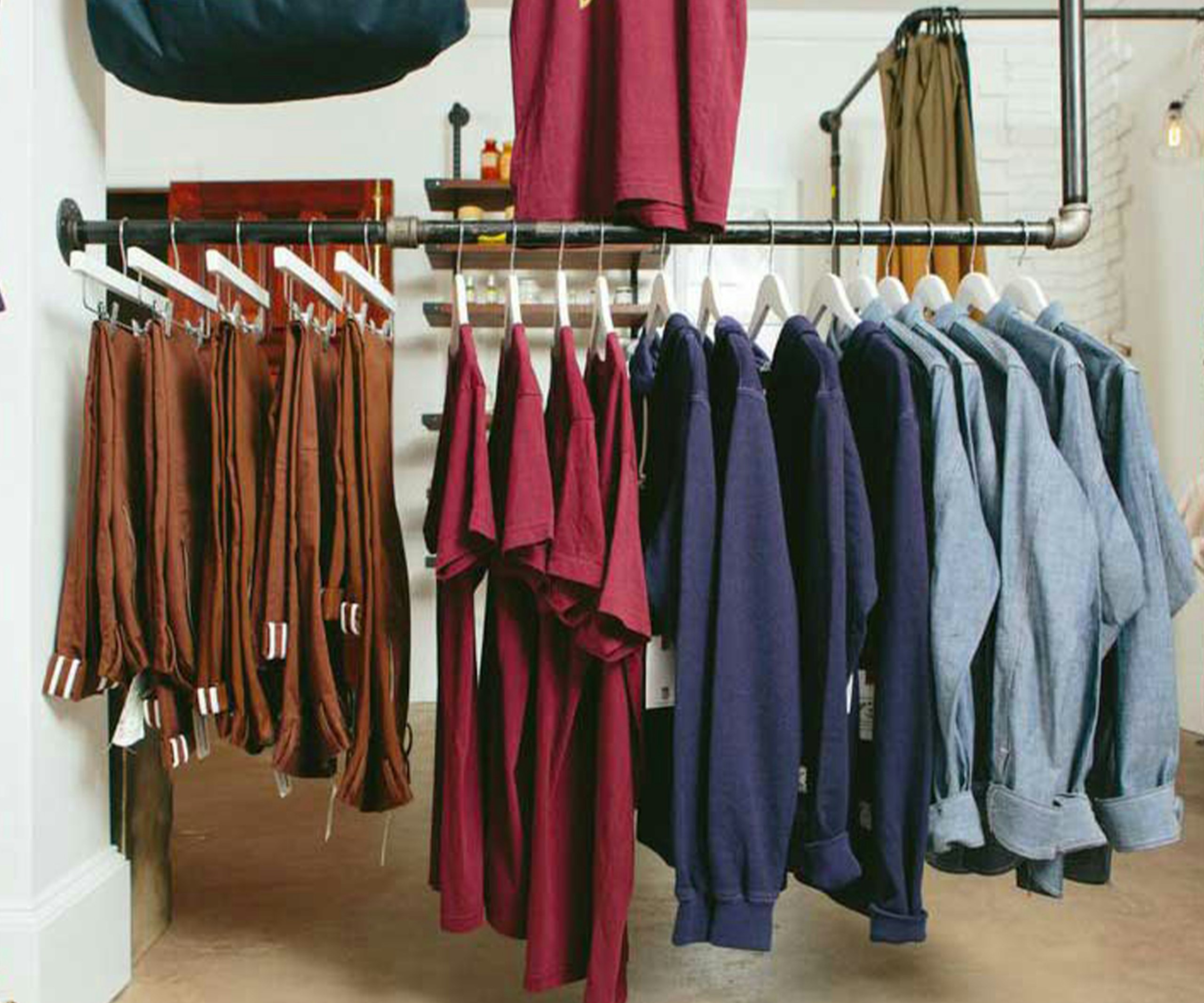 pants, t-shirts, and long-sleeve shirts hanging