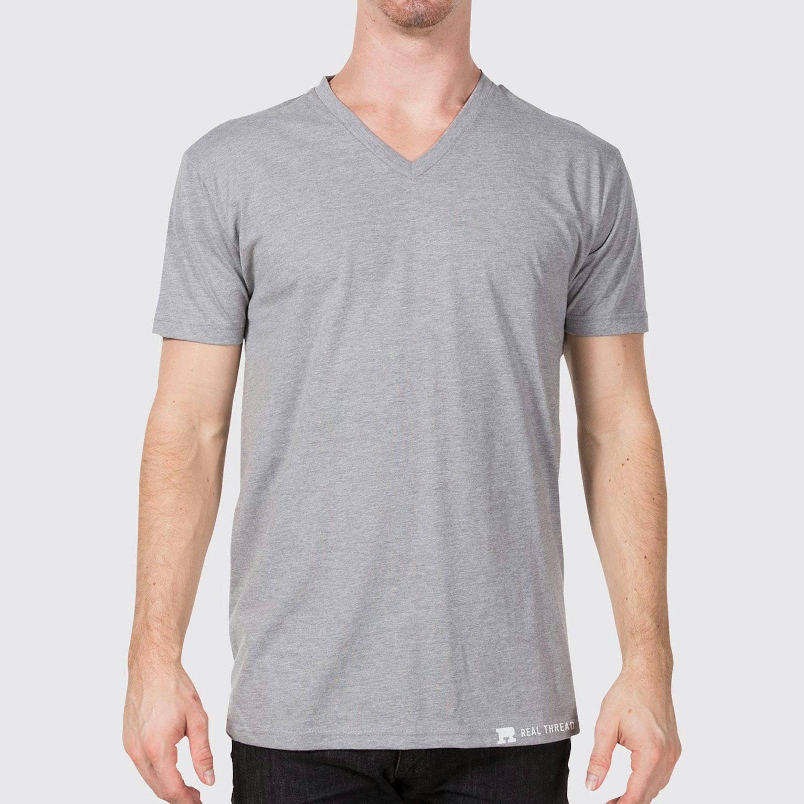 man wearing a light grey v-neck t-shirt