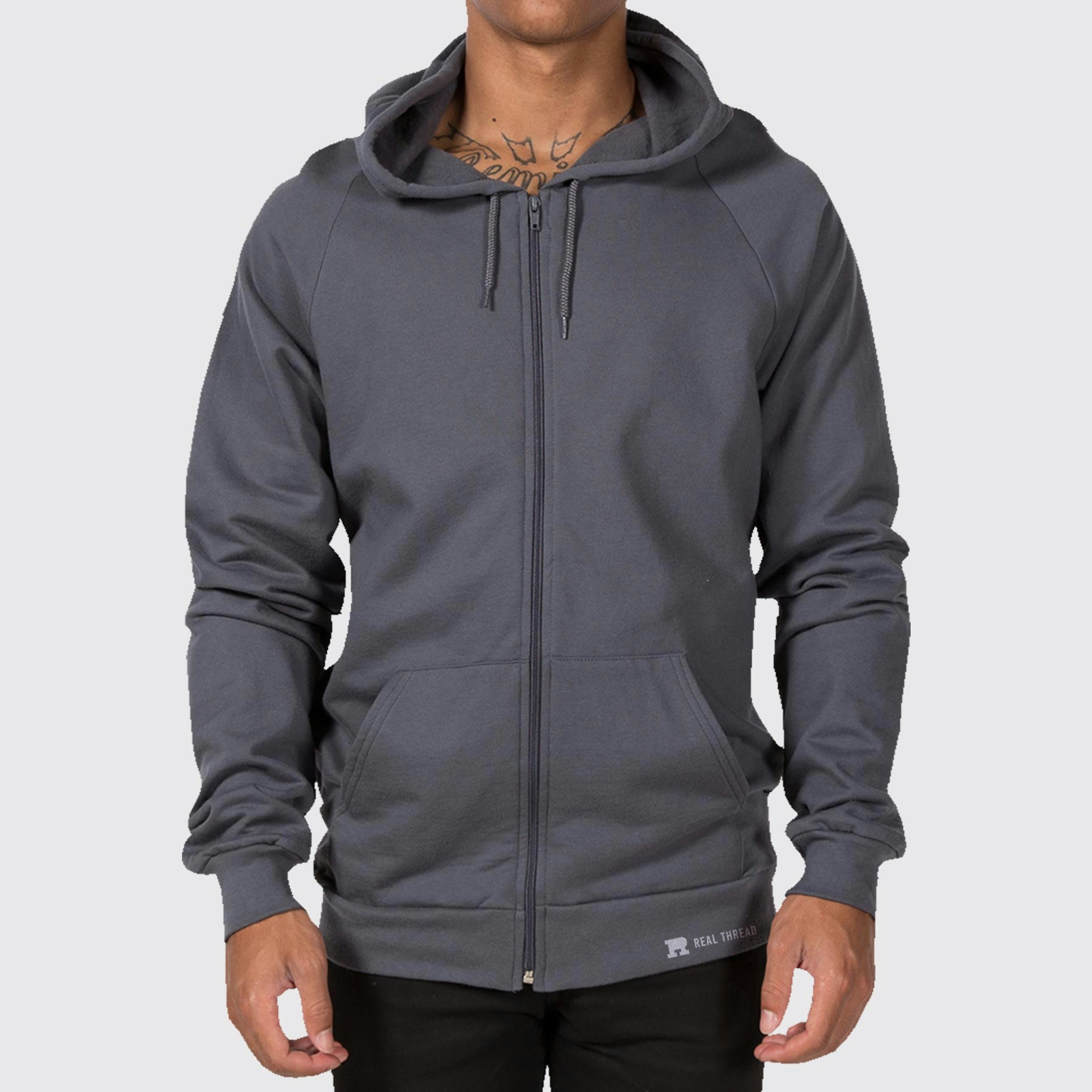 man wearing a dark grey zip-up hoodie