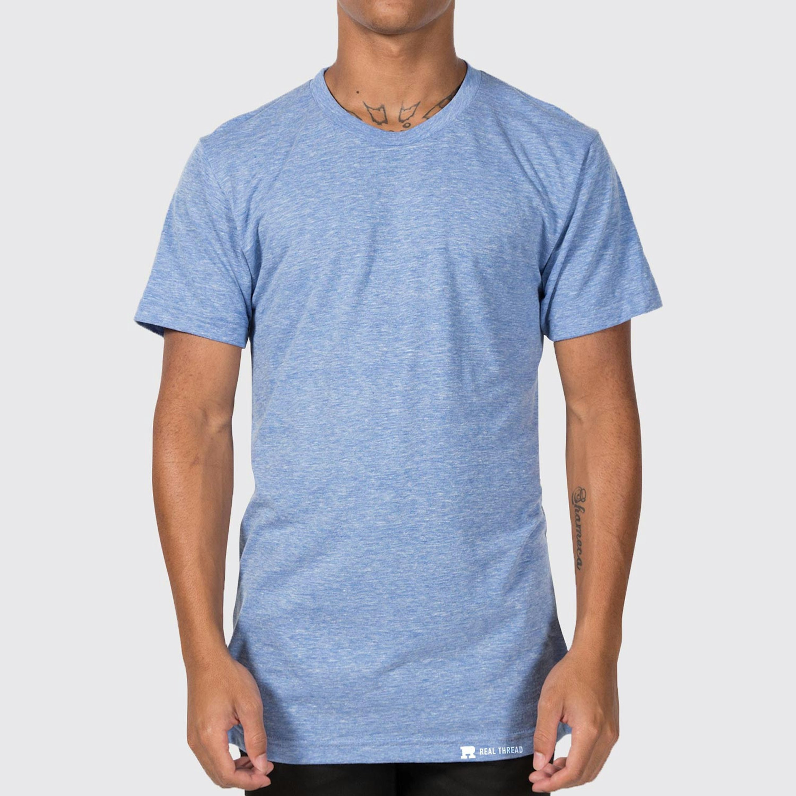 a man wearing a light blue tri-blend t-shirt